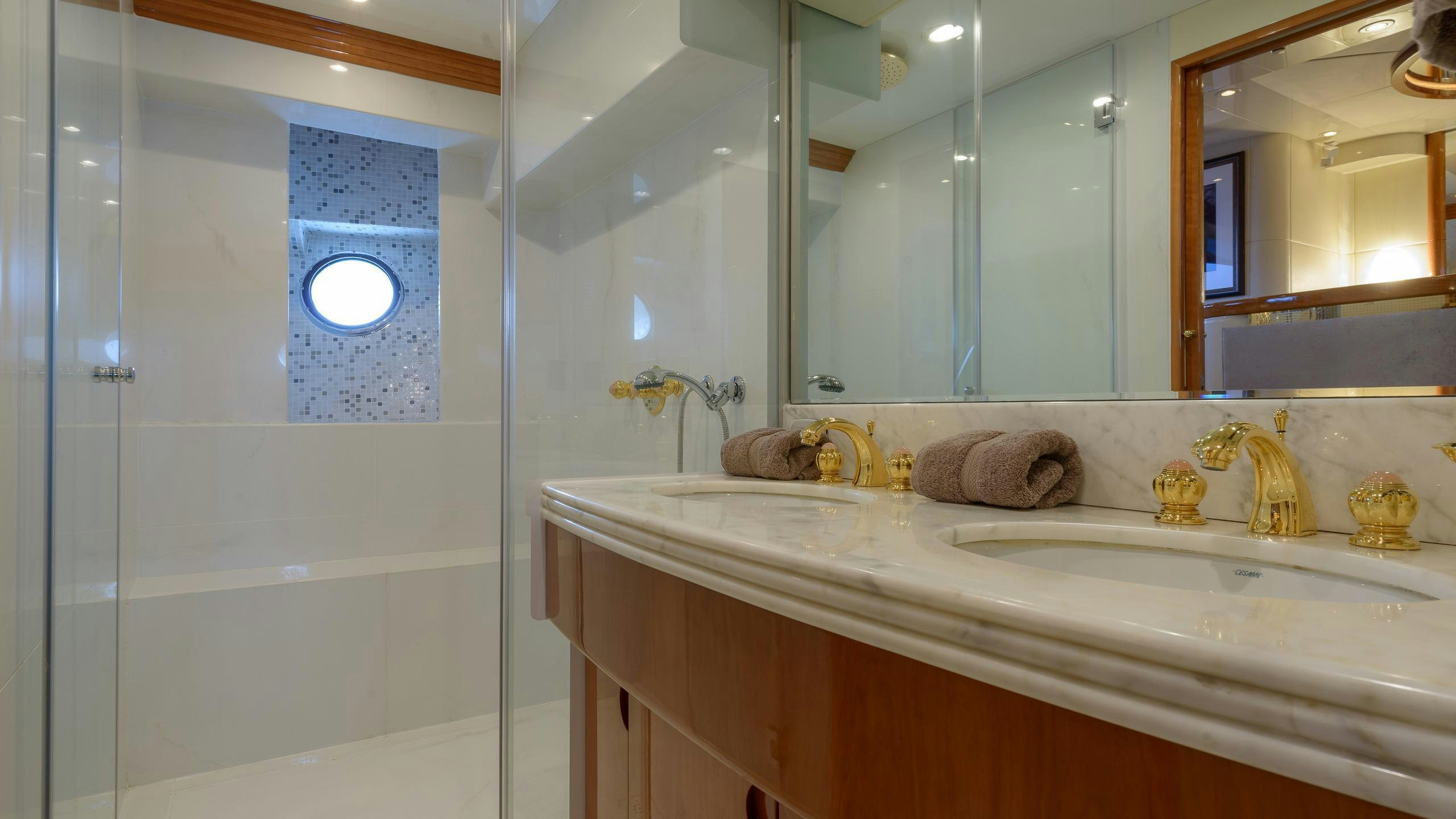 a bathroom with a large mirror aboard NOVELA Yacht for Charter