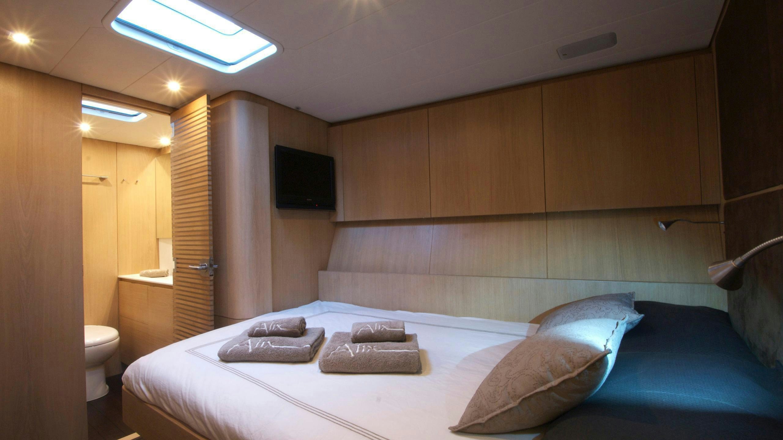 a bed in a room aboard YCH2 Yacht for Charter
