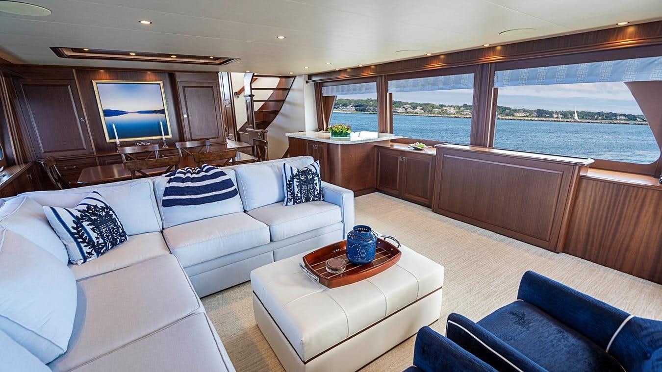 a living room with a large window aboard TRANQUILITY Yacht for Charter