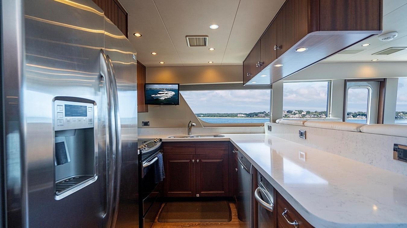 a kitchen with a large refrigerator aboard TRANQUILITY Yacht for Charter