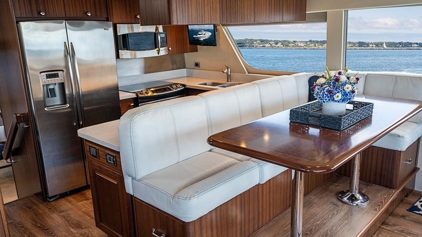 a kitchen with a large refrigerator aboard TRANQUILITY Yacht for Charter