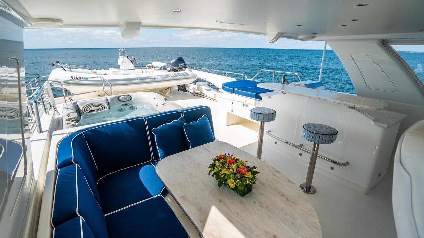 a boat with chairs and tables aboard TRANQUILITY Yacht for Charter