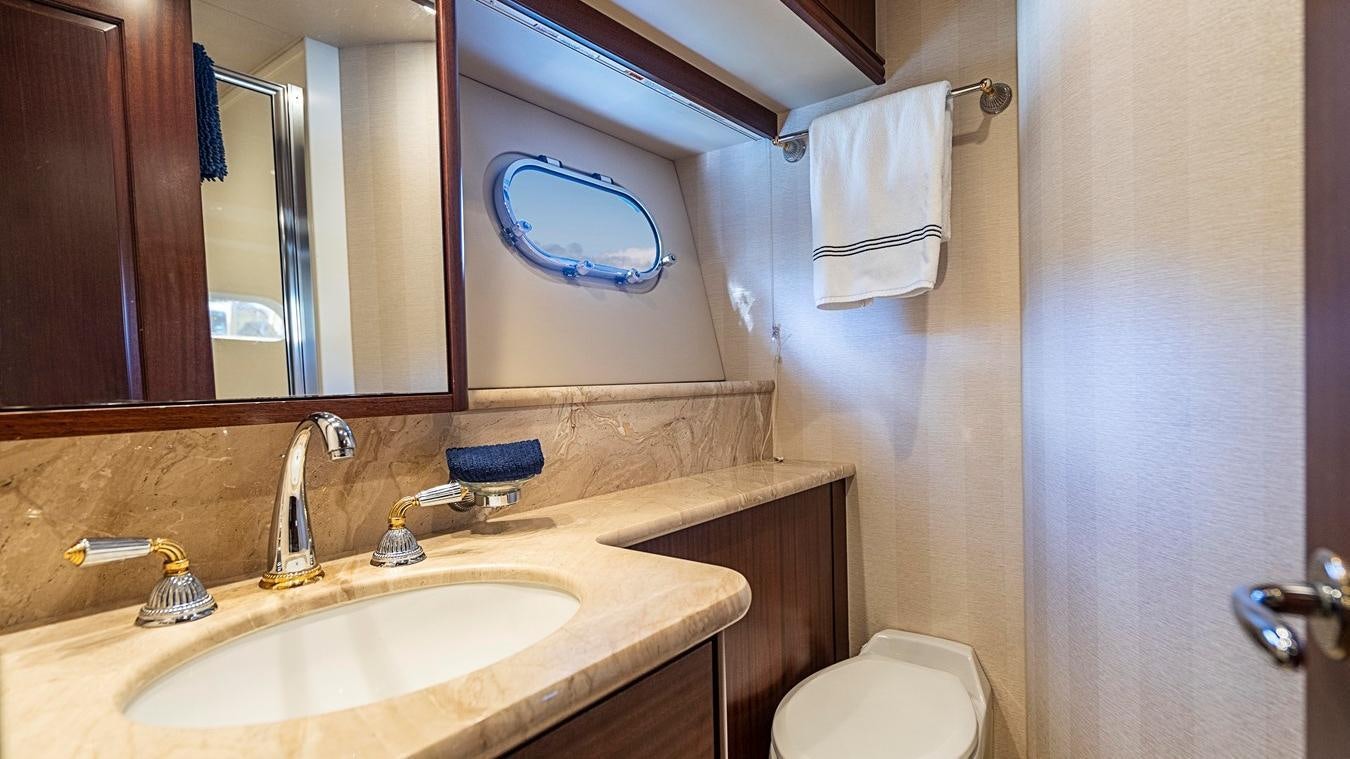 a bathroom with a sink and a toilet aboard TRANQUILITY Yacht for Charter