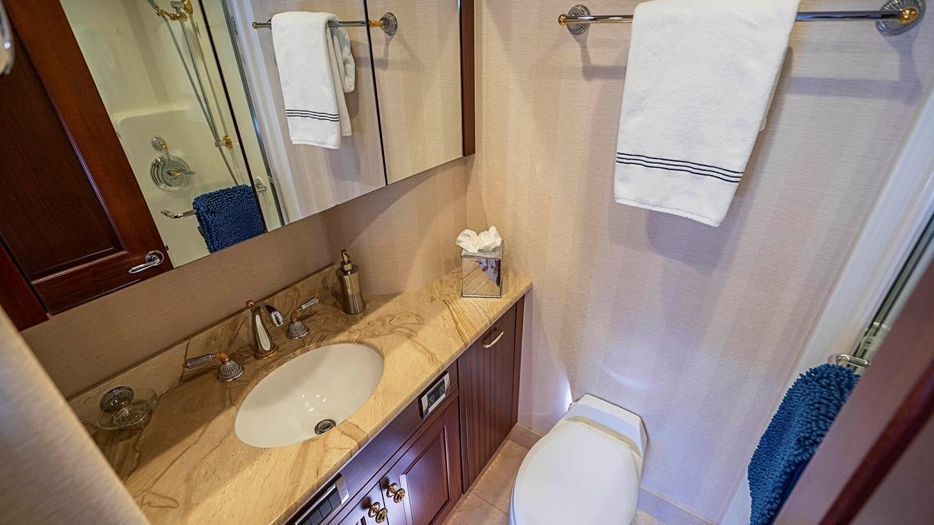 a bathroom with a sink and a toilet aboard TRANQUILITY Yacht for Charter