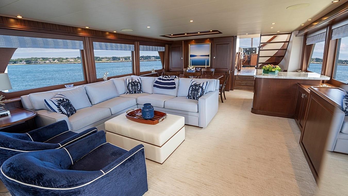 a living room with a large window aboard TRANQUILITY Yacht for Charter