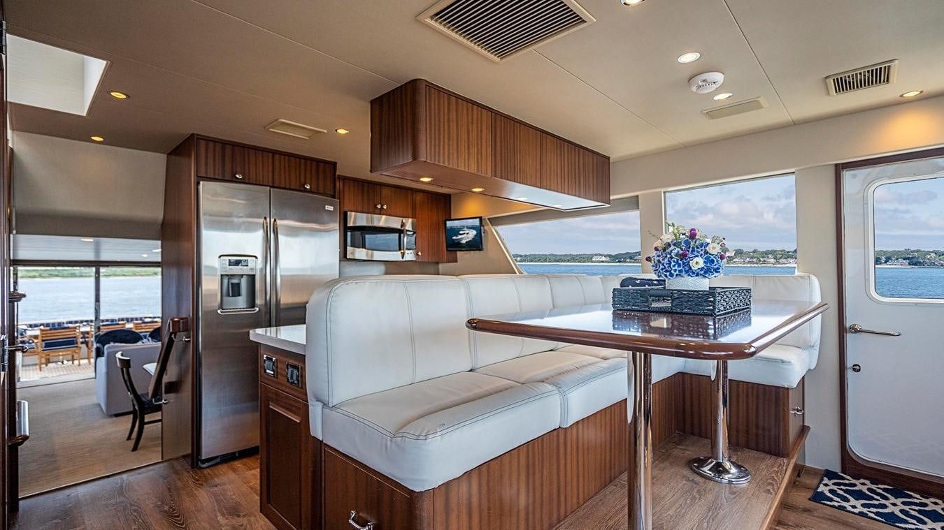 a living room with a couch and a table aboard TRANQUILITY Yacht for Charter