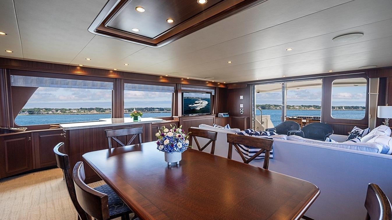 a room with a table and chairs aboard TRANQUILITY Yacht for Charter