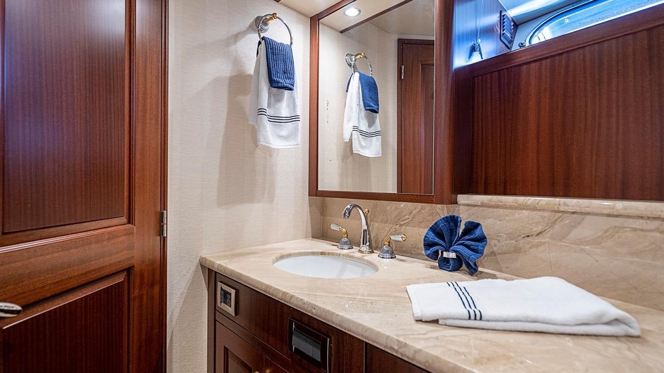 a bathroom with a countertop sink and mirror aboard TRANQUILITY Yacht for Charter