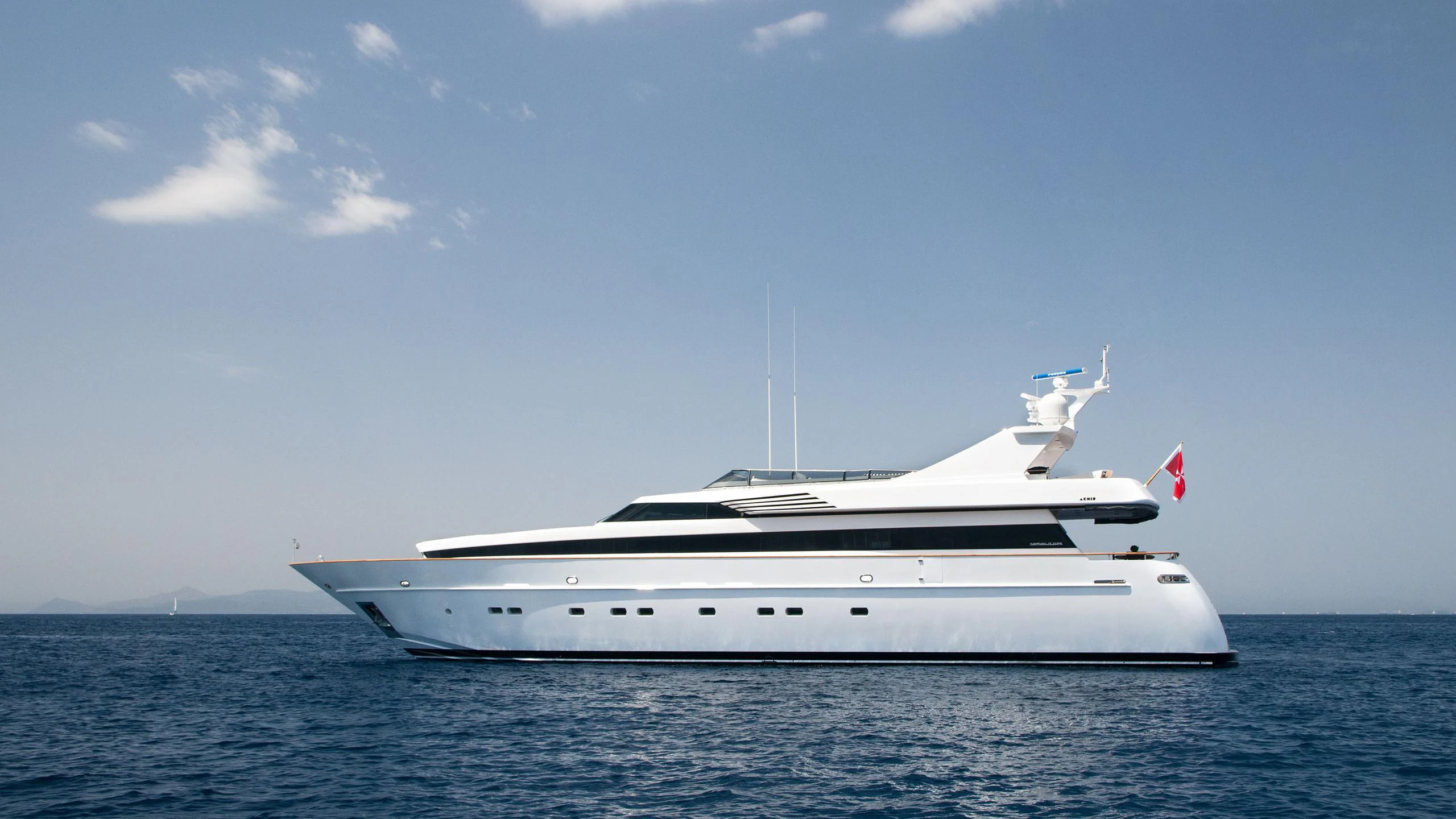 a white yacht in the water aboard REGINA K Yacht for Charter
