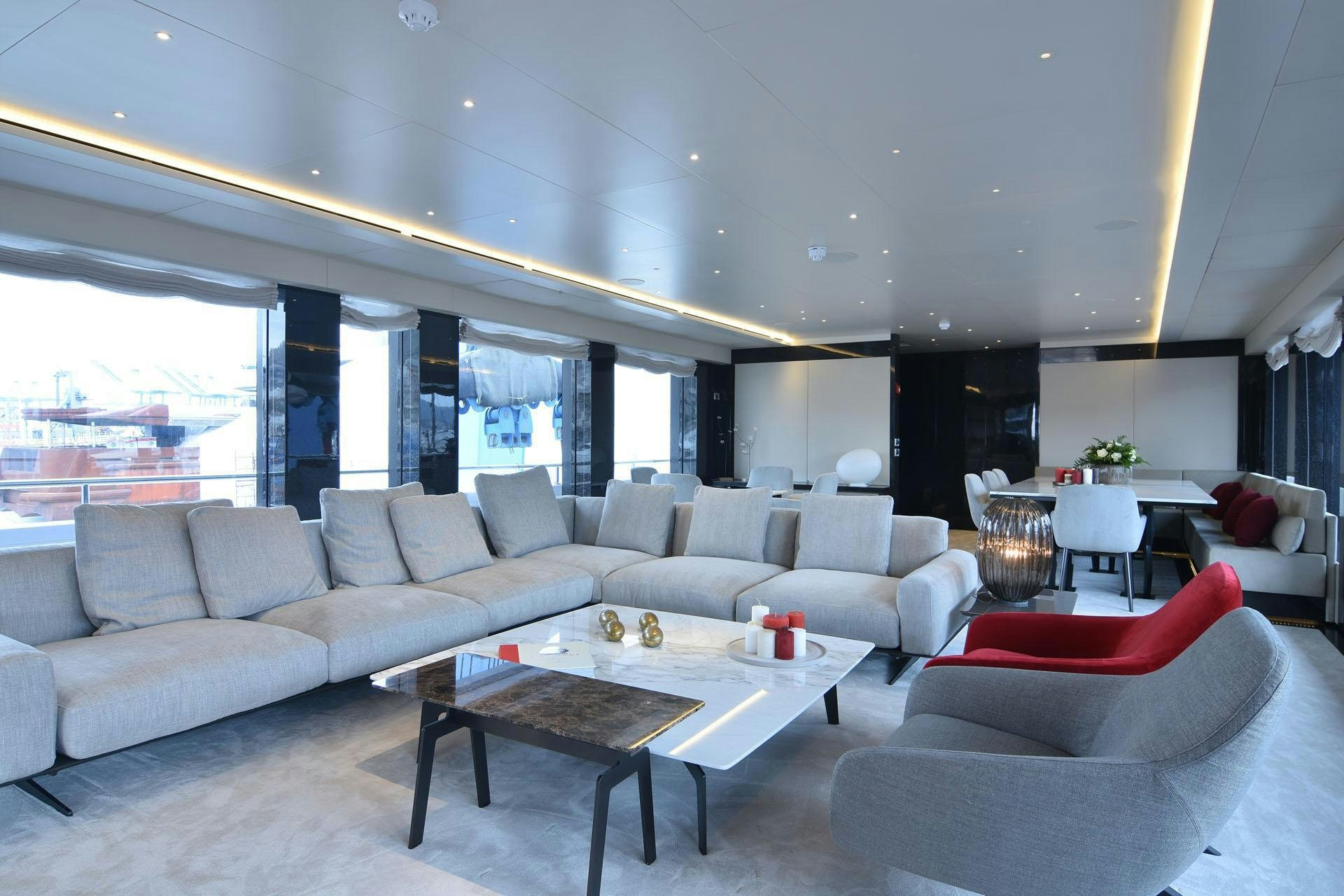 a living room with a large window aboard MY EDEN Yacht for Charter