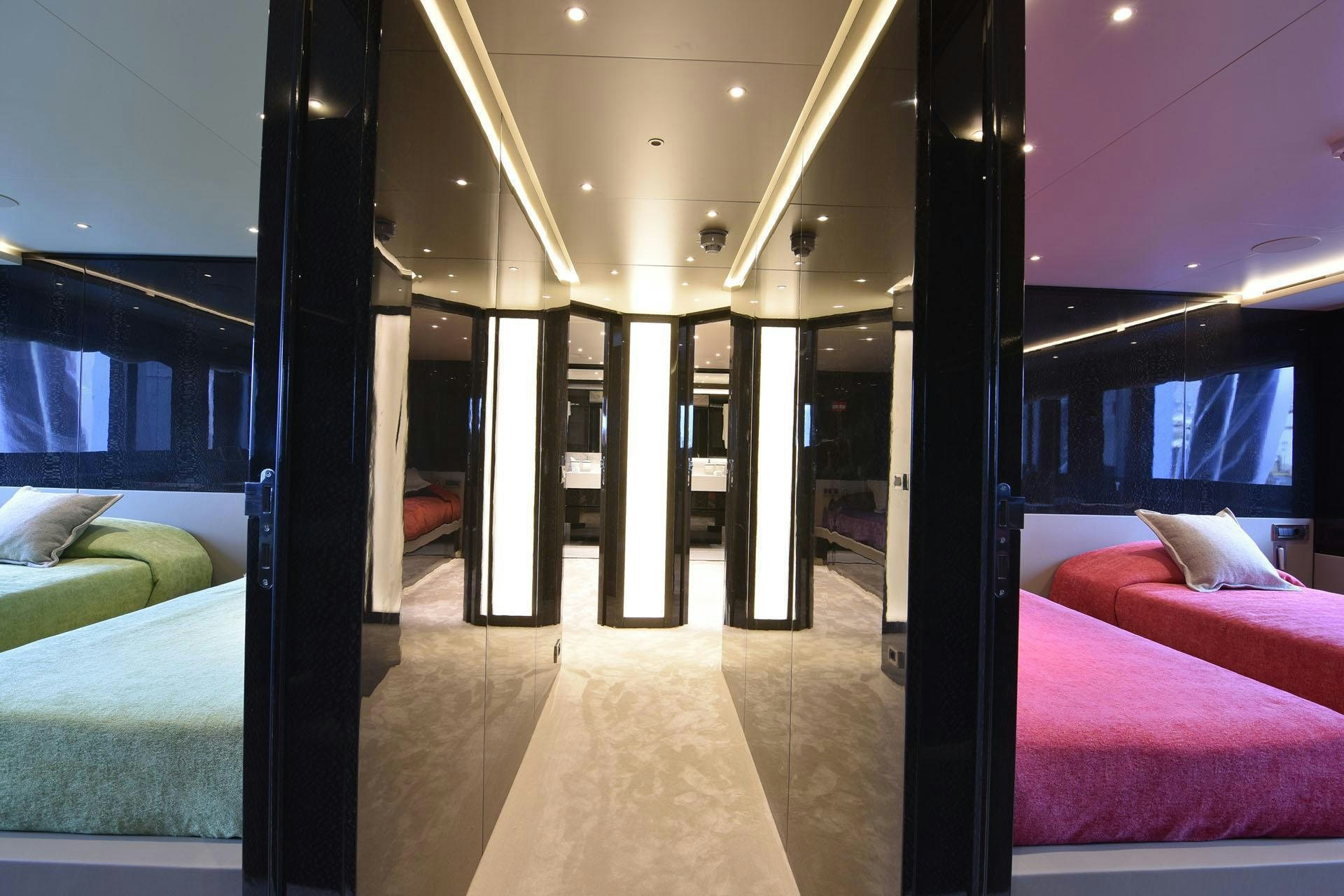 a room with a bed and a window aboard MY EDEN Yacht for Charter