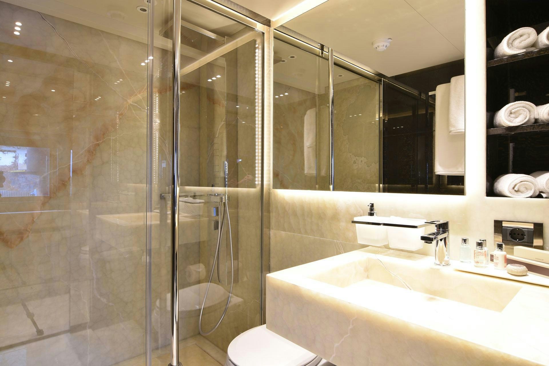 a bathroom with a glass shower aboard MY EDEN Yacht for Charter