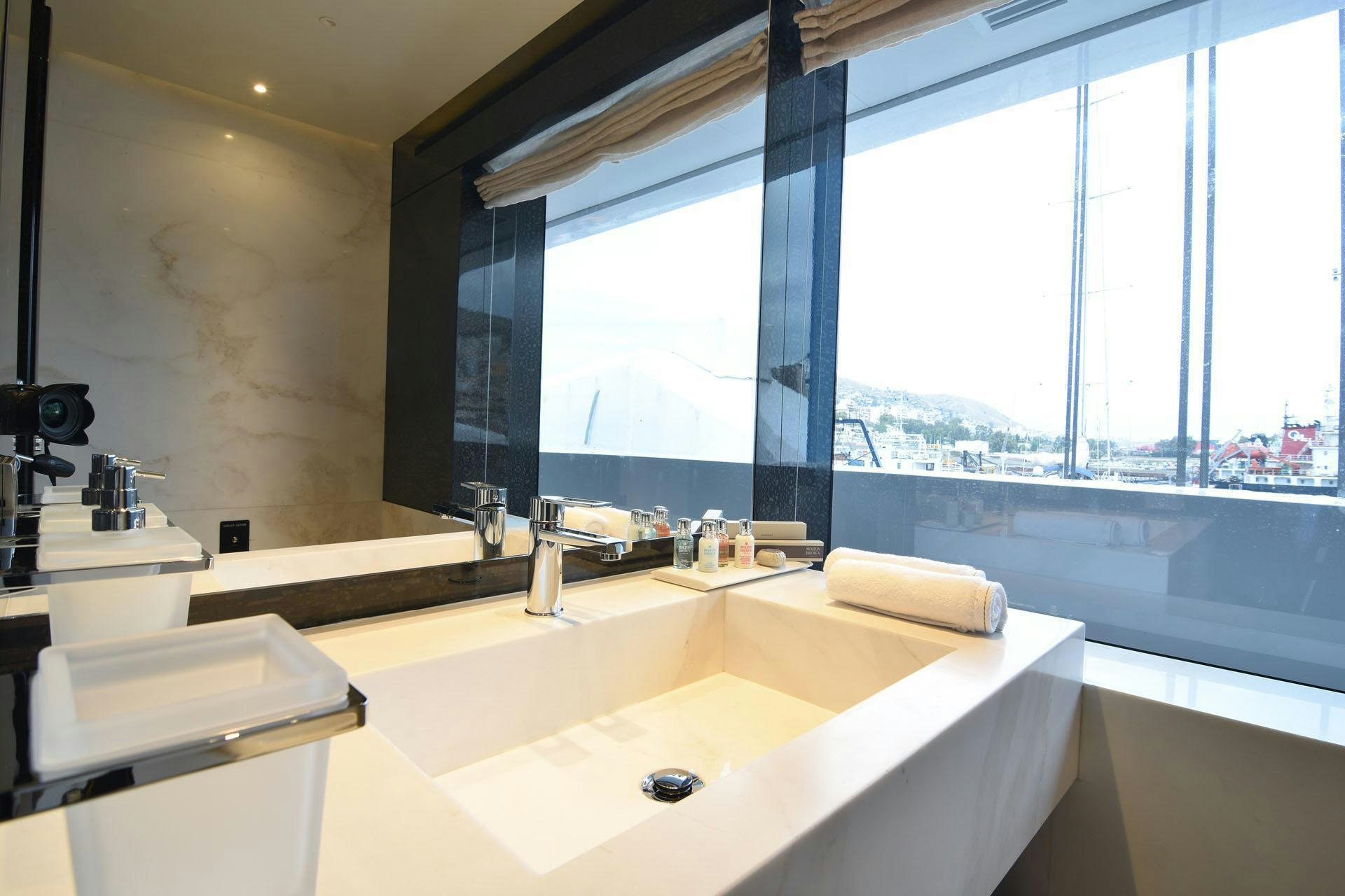 a bathroom with a large window aboard MY EDEN Yacht for Charter