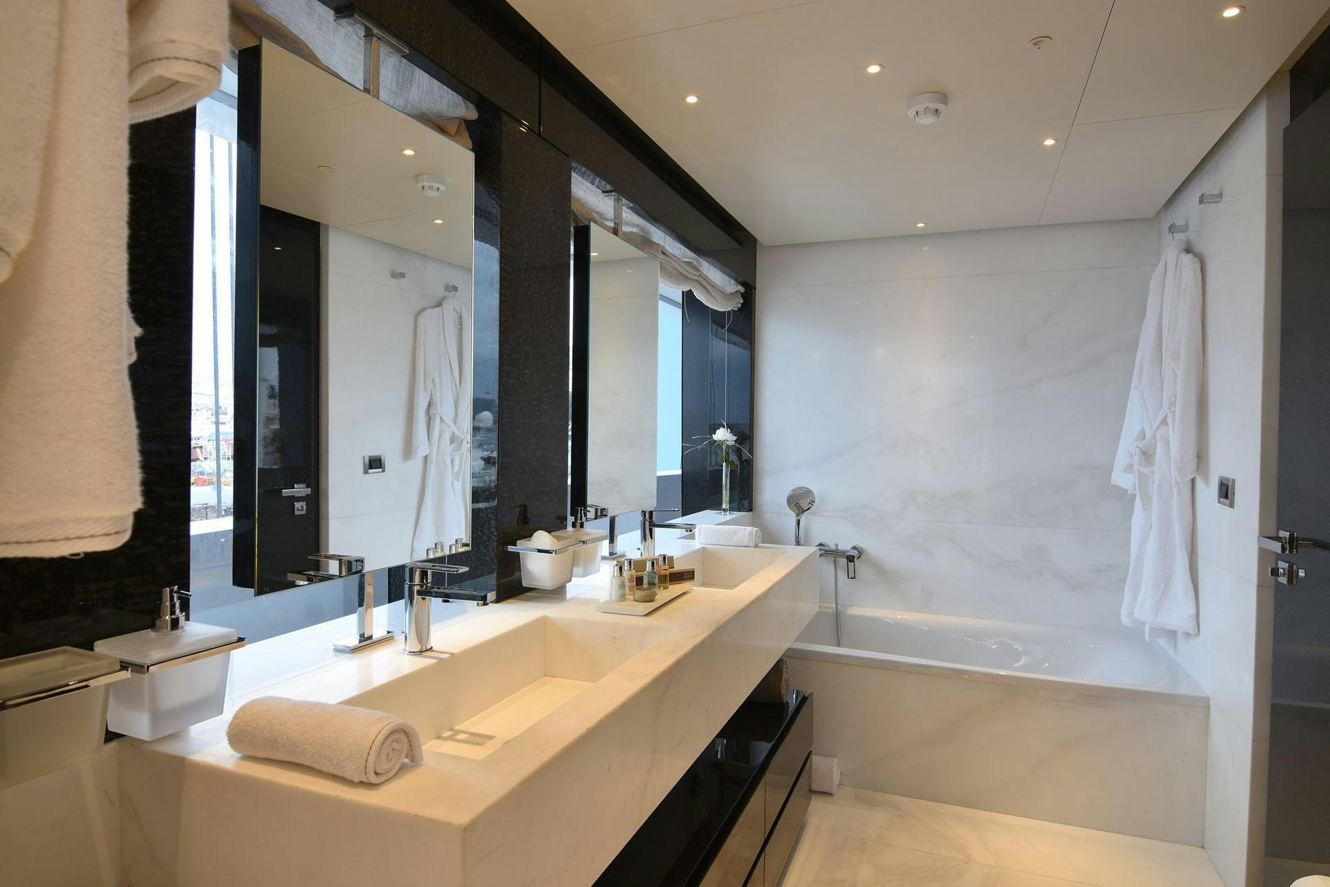 a bathroom with a large mirror aboard MY EDEN Yacht for Charter