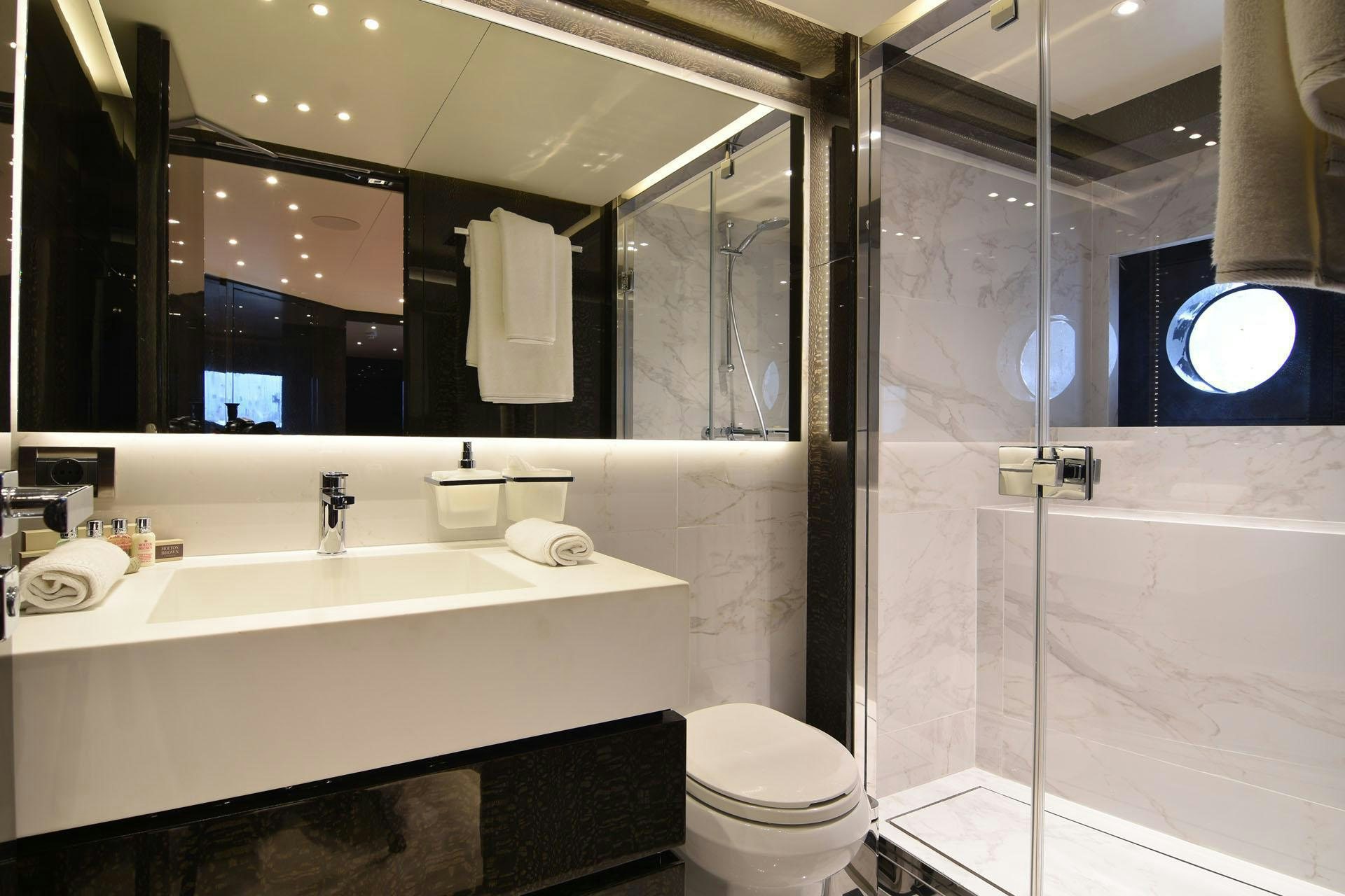 a bathroom with a glass shower aboard MY EDEN Yacht for Charter