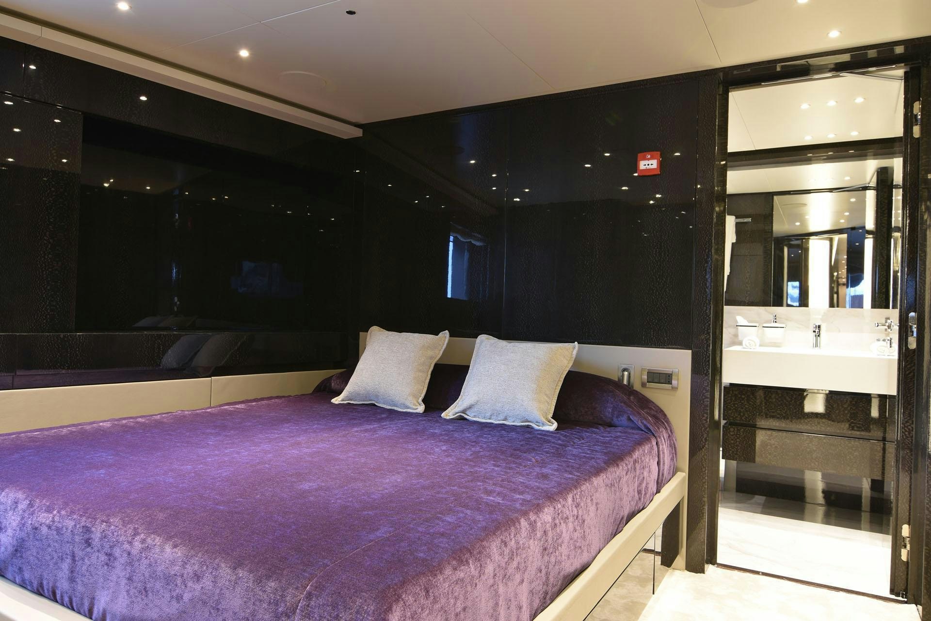 a bed in a room aboard MY EDEN Yacht for Charter