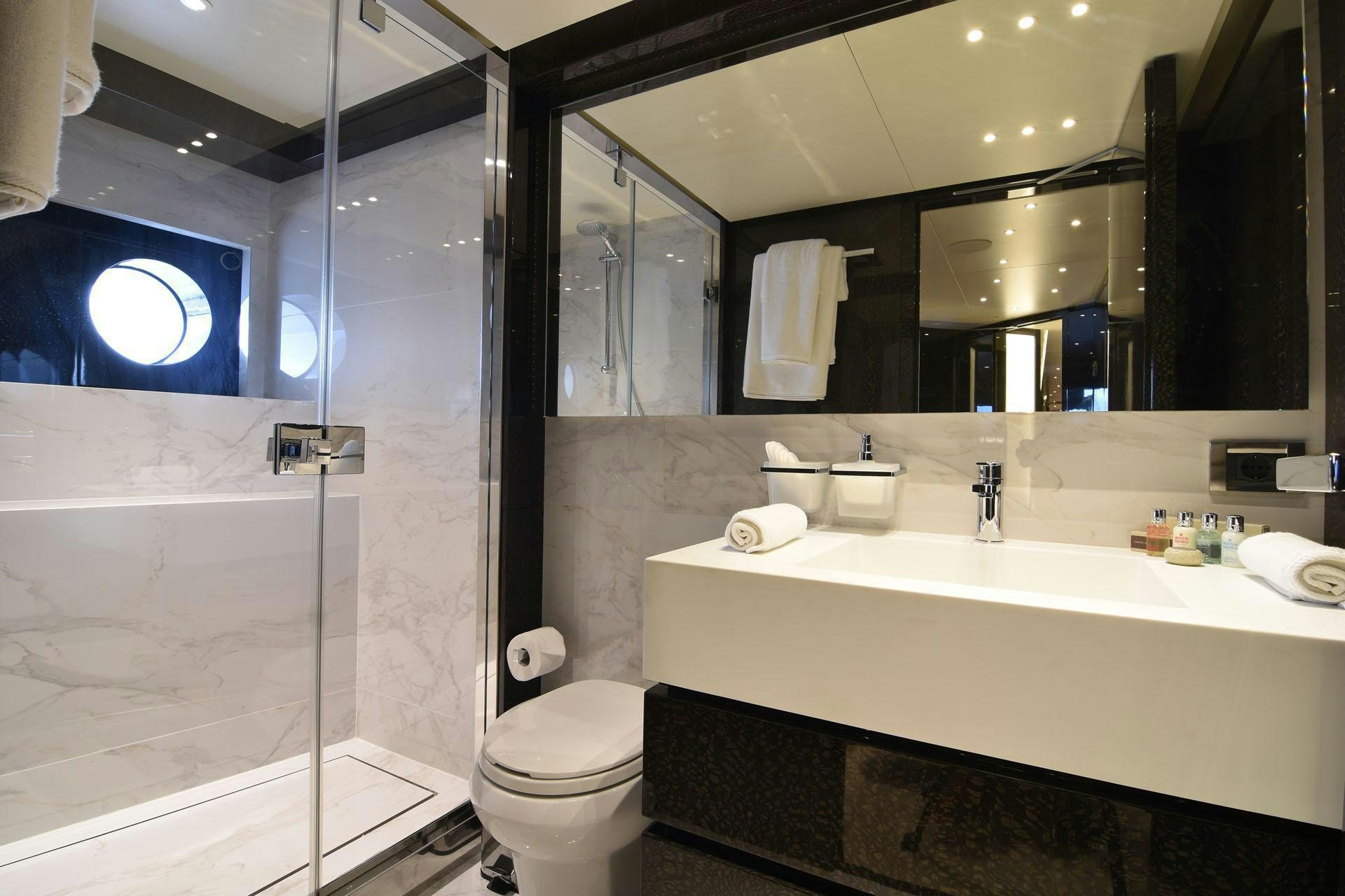 a bathroom with a glass shower aboard MY EDEN Yacht for Charter