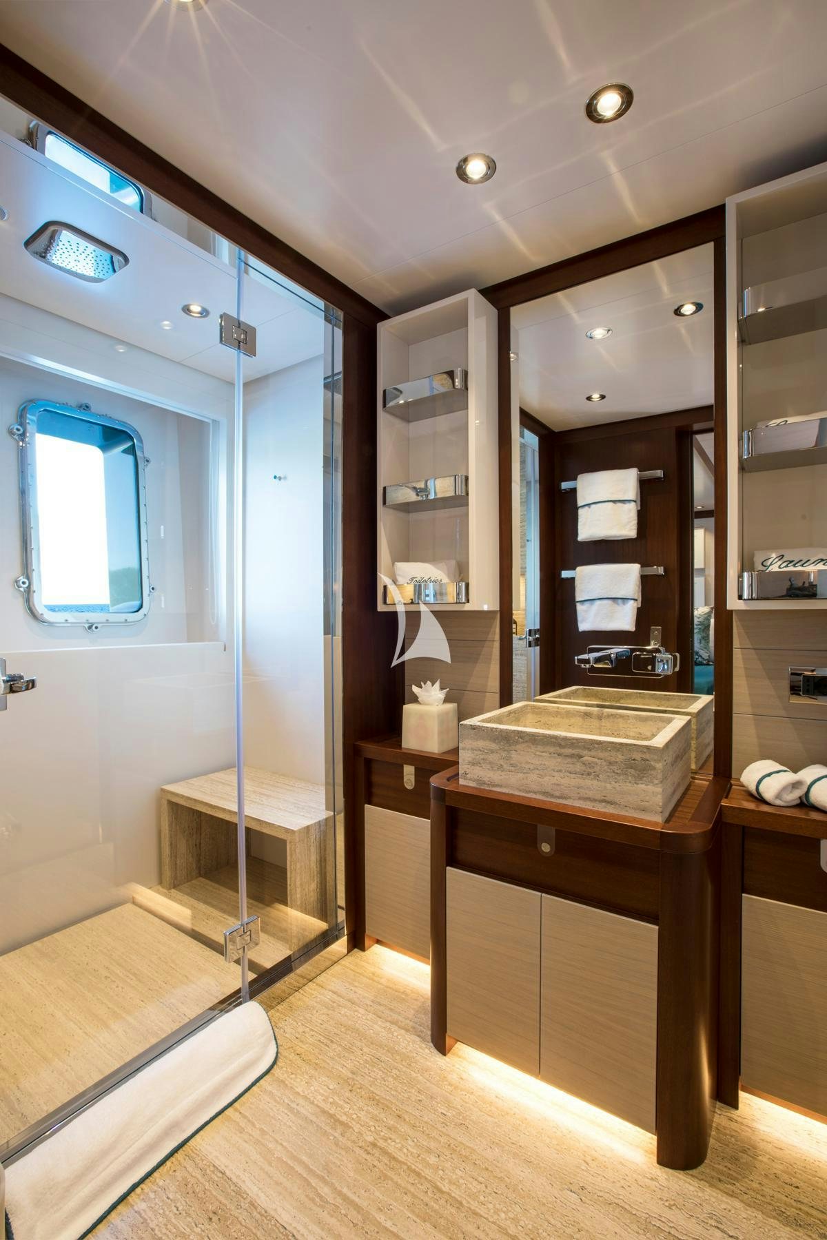 a room with a mirror and a table aboard MOKA Yacht for Charter