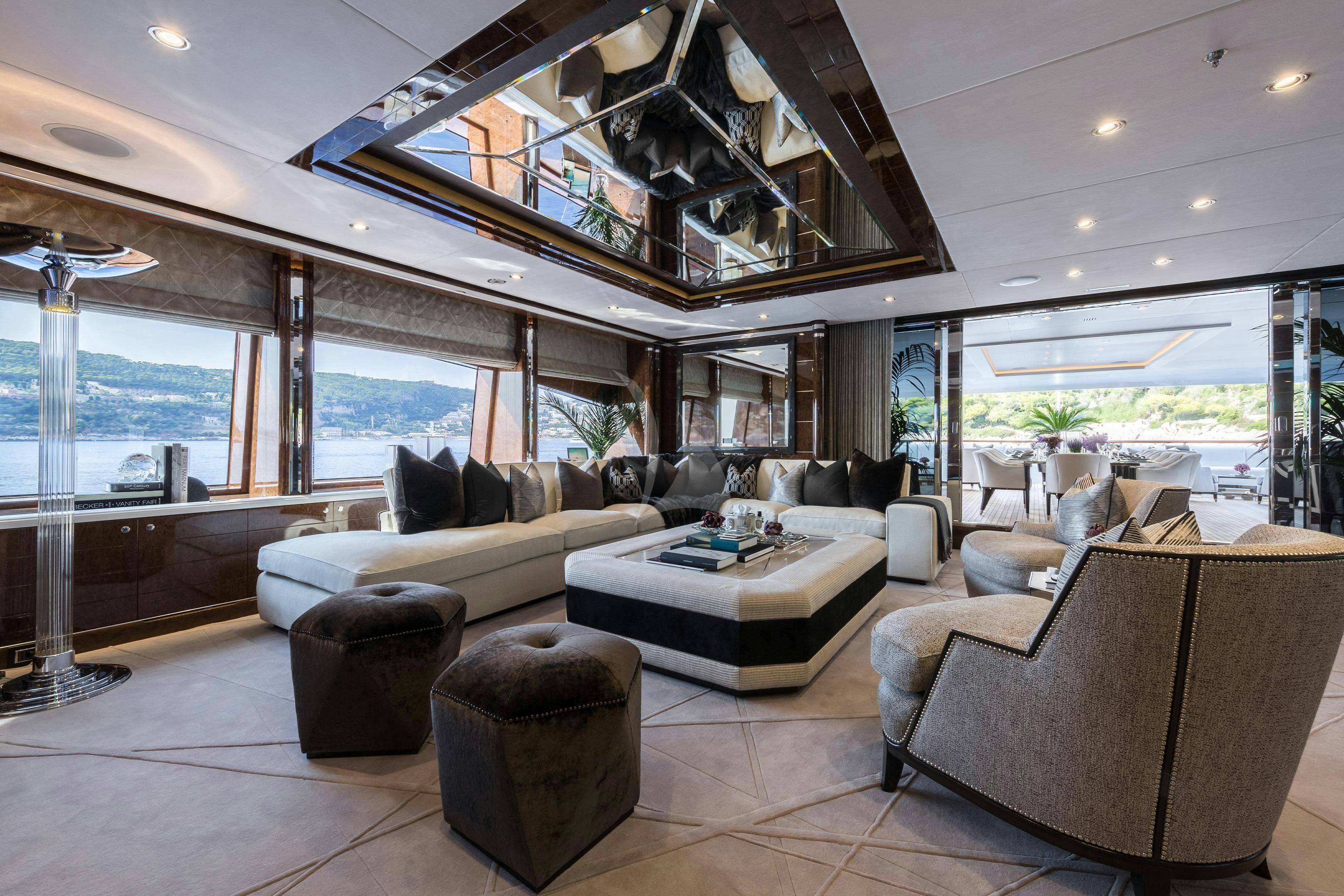 a living room with a large glass window aboard SOUNDWAVE Yacht for Charter
