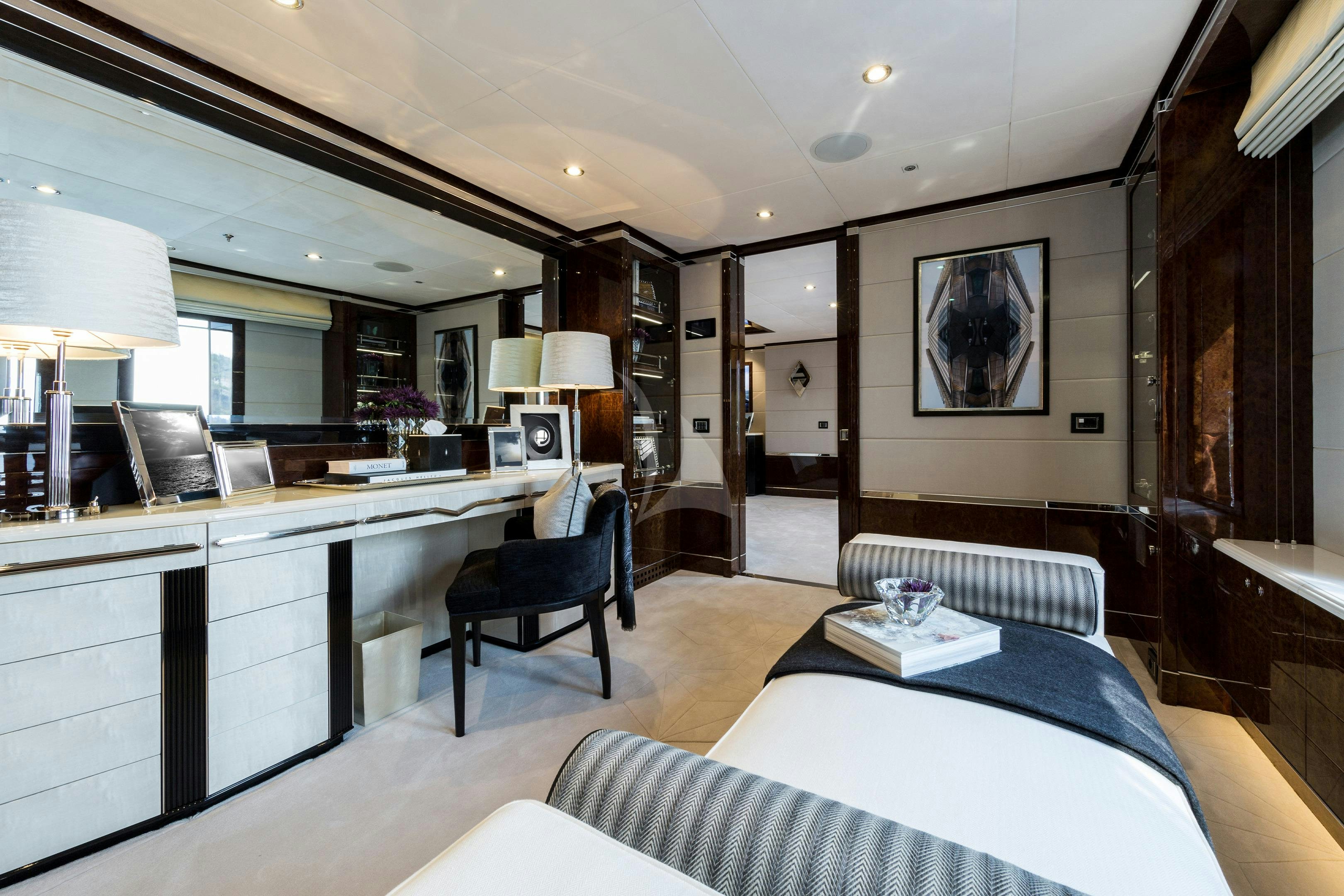 a room with a desk and a bed aboard SOUNDWAVE Yacht for Charter