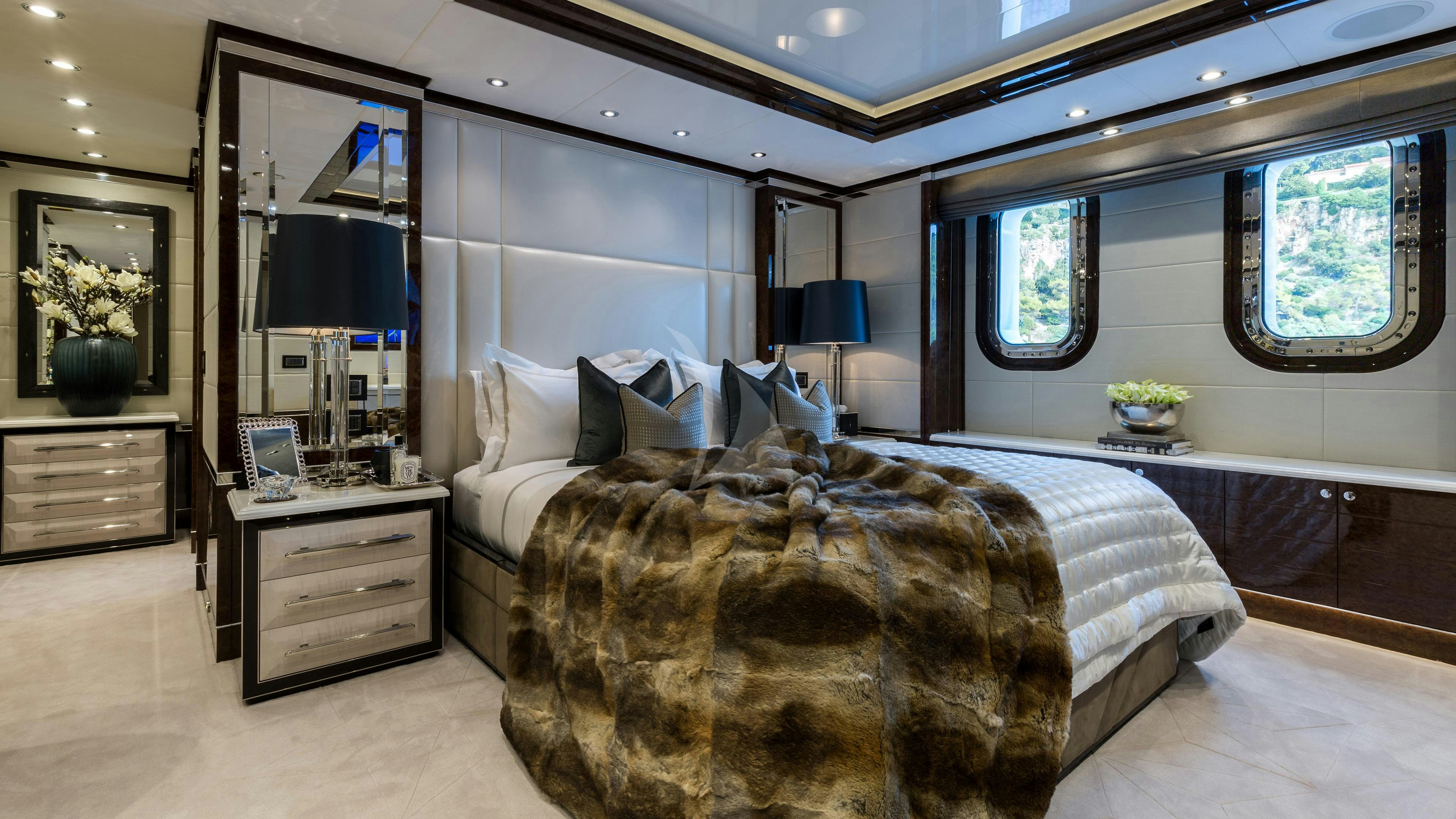 a bedroom with a large bed aboard SOUNDWAVE Yacht for Charter