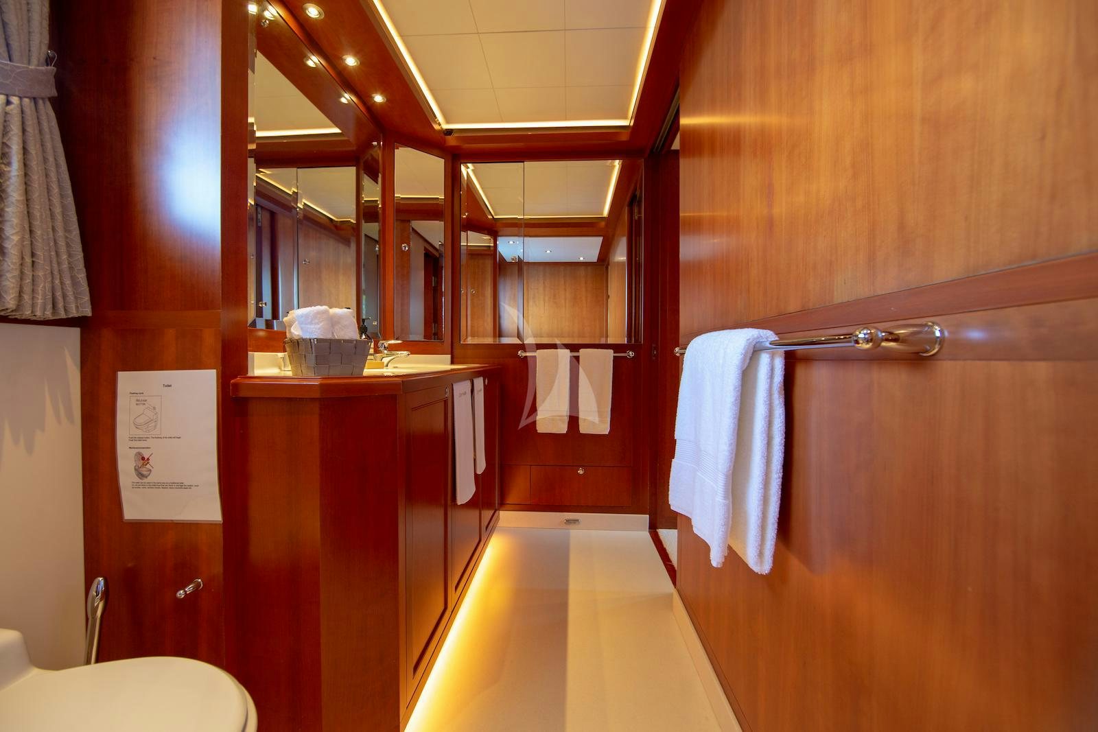 a bathroom with a sink and a mirror aboard CORNELIA Yacht for Charter