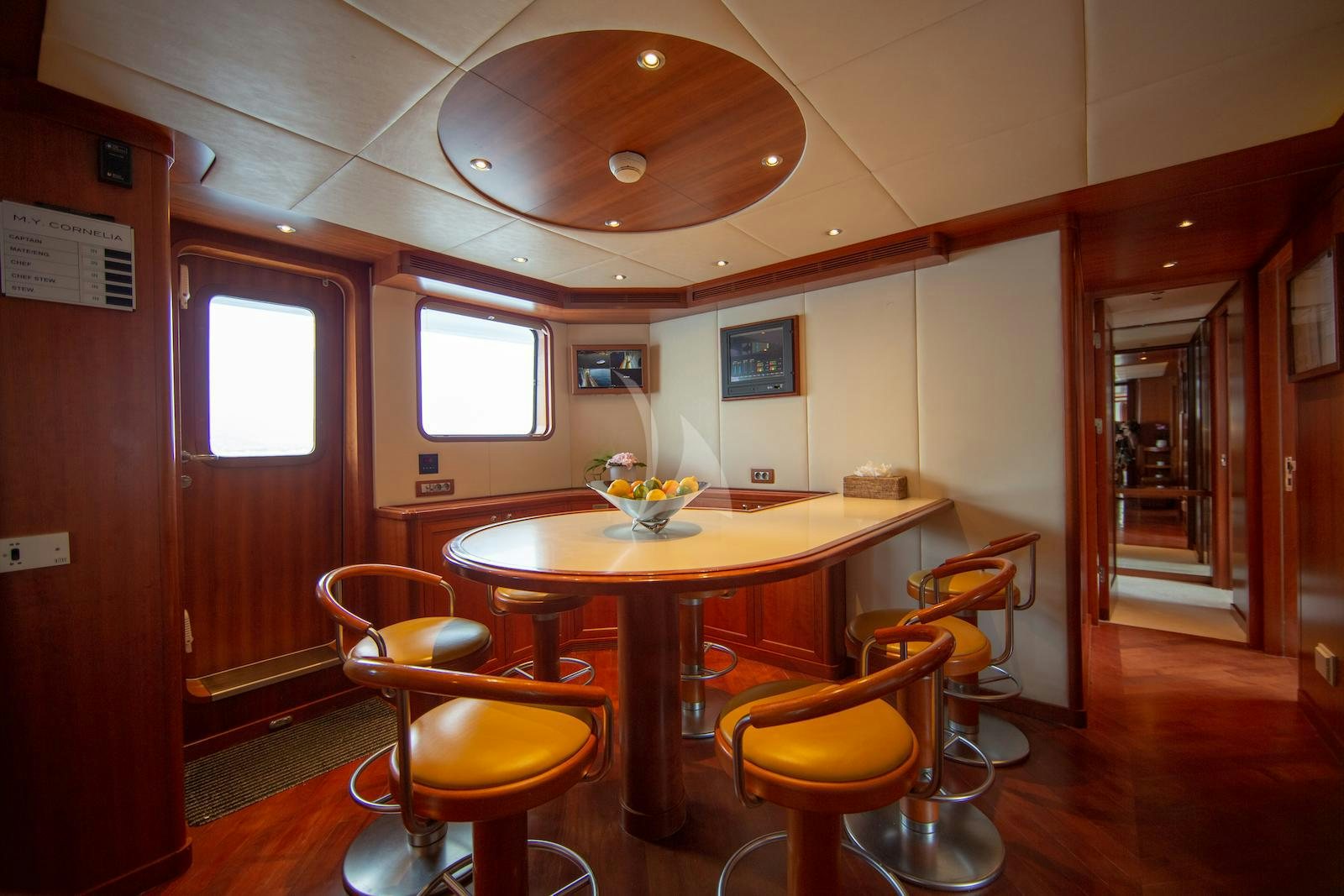 a table and chairs in a room aboard CORNELIA Yacht for Charter