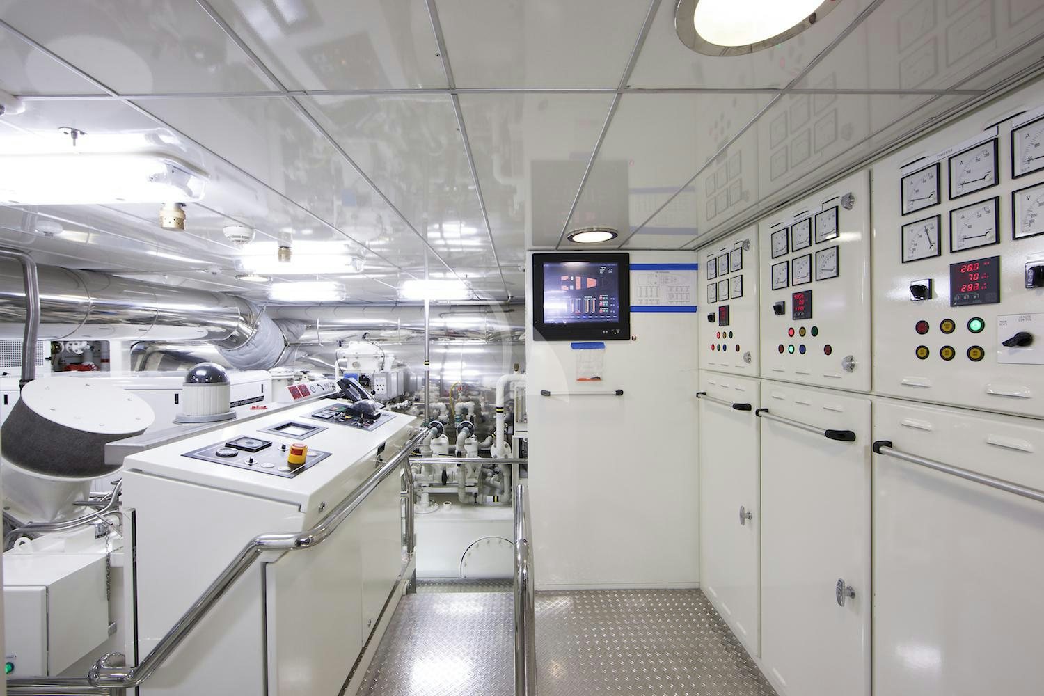a room with white cabinets and white appliances aboard CORNELIA Yacht for Charter