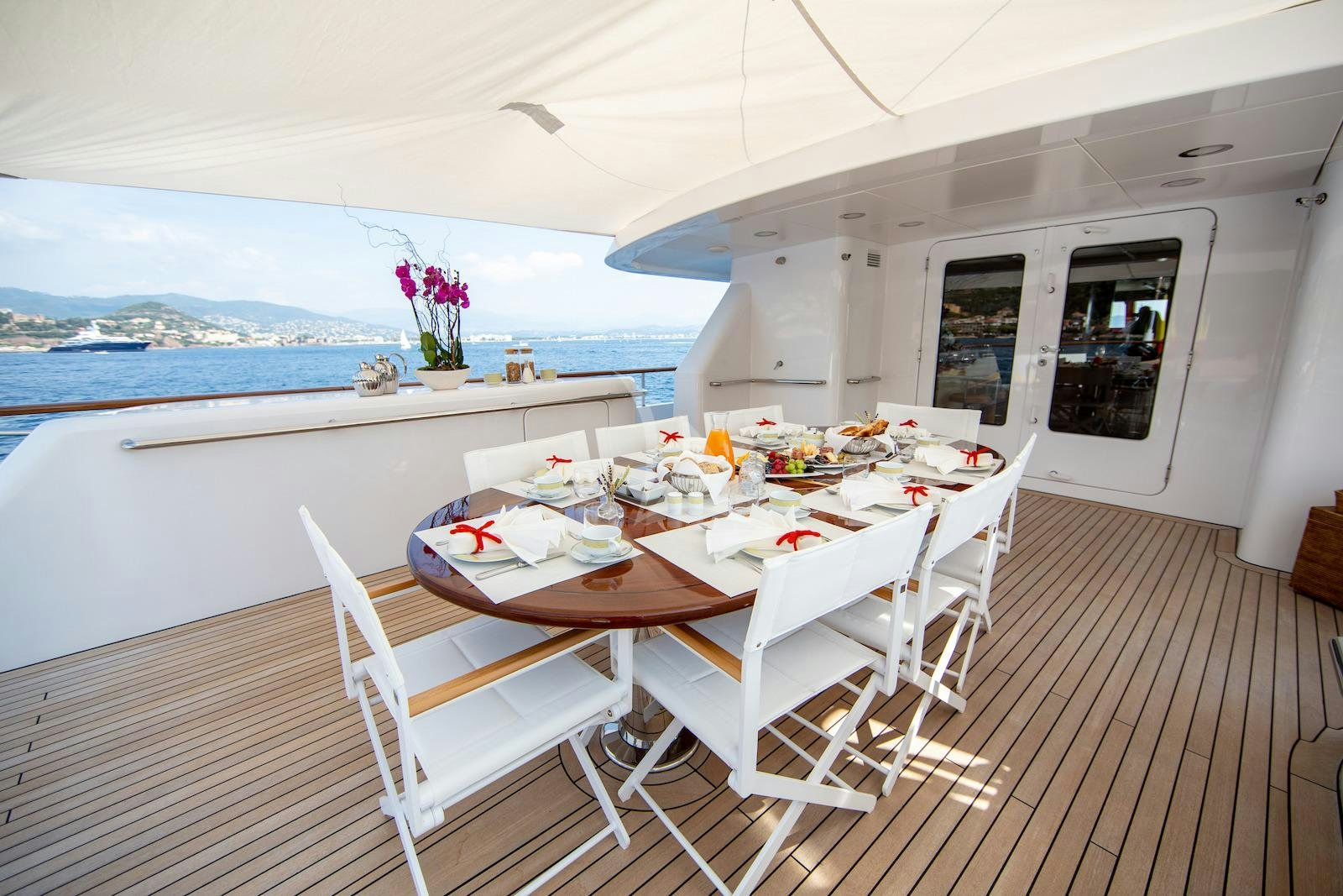 a dining table on a boat aboard CORNELIA Yacht for Charter