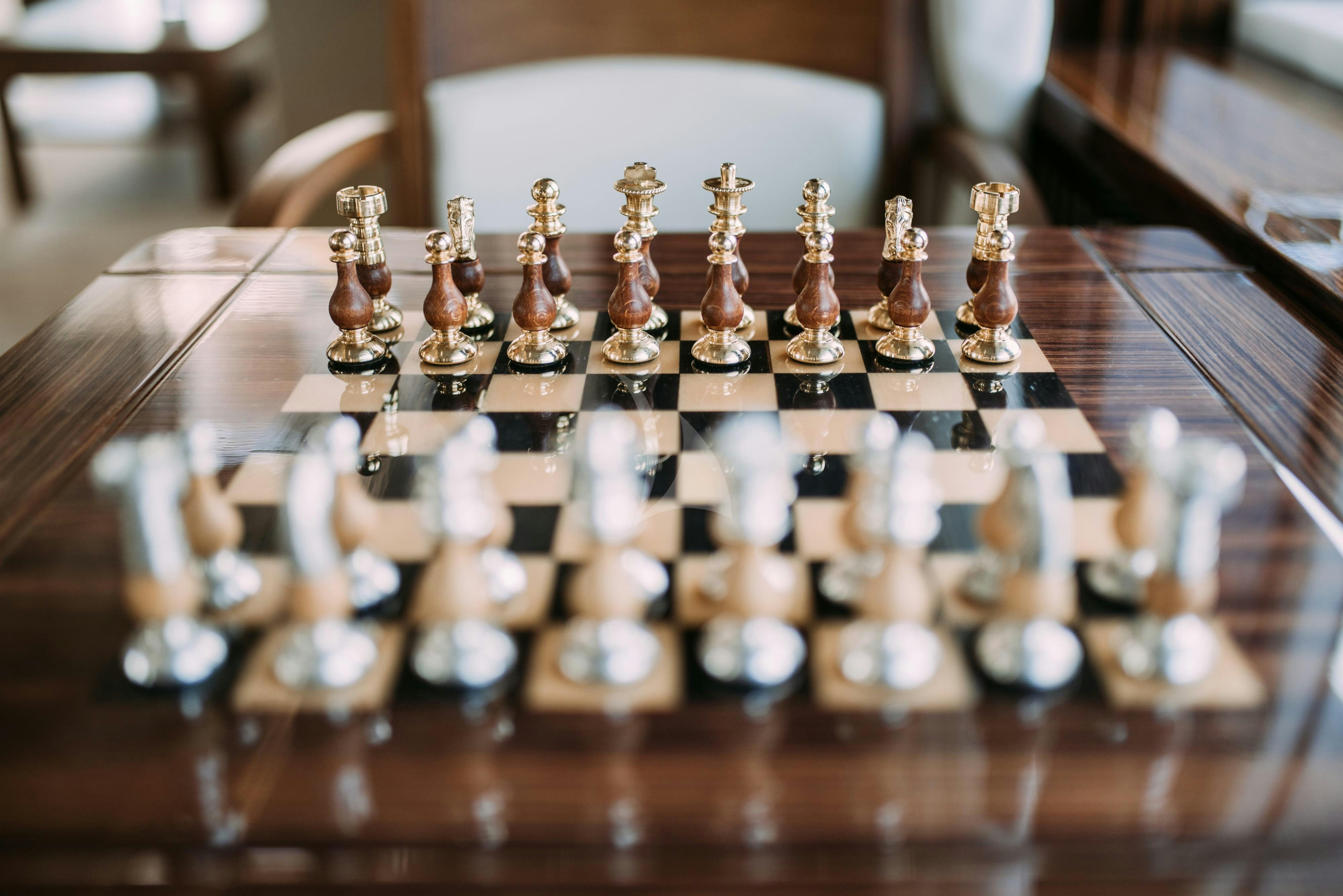 a chess board with a chess board aboard ARTEMY Yacht for Charter