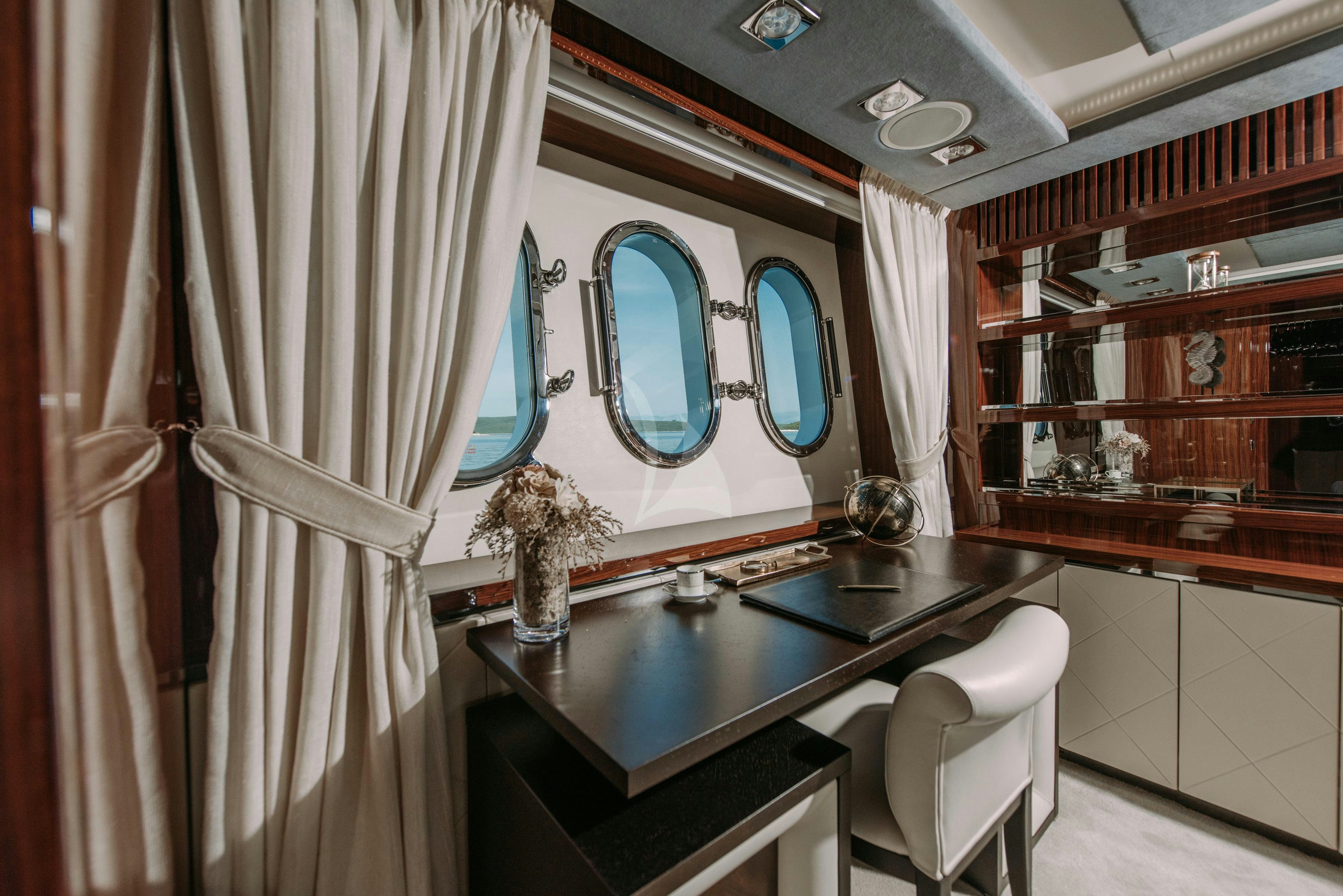 a room with a table and chairs aboard ARTEMY Yacht for Charter