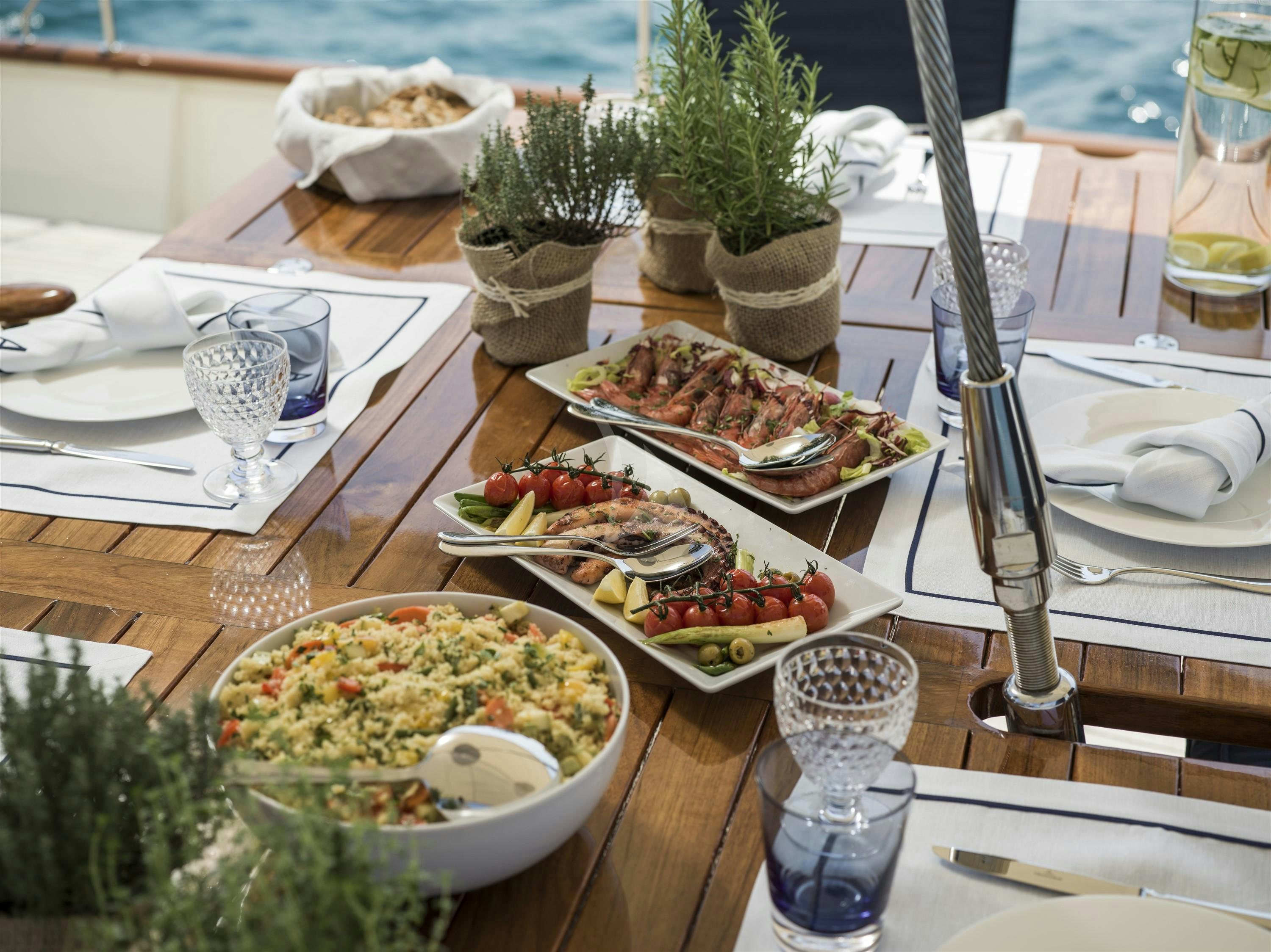 a table with food on it aboard ALEXA OF LONDON Yacht for Charter
