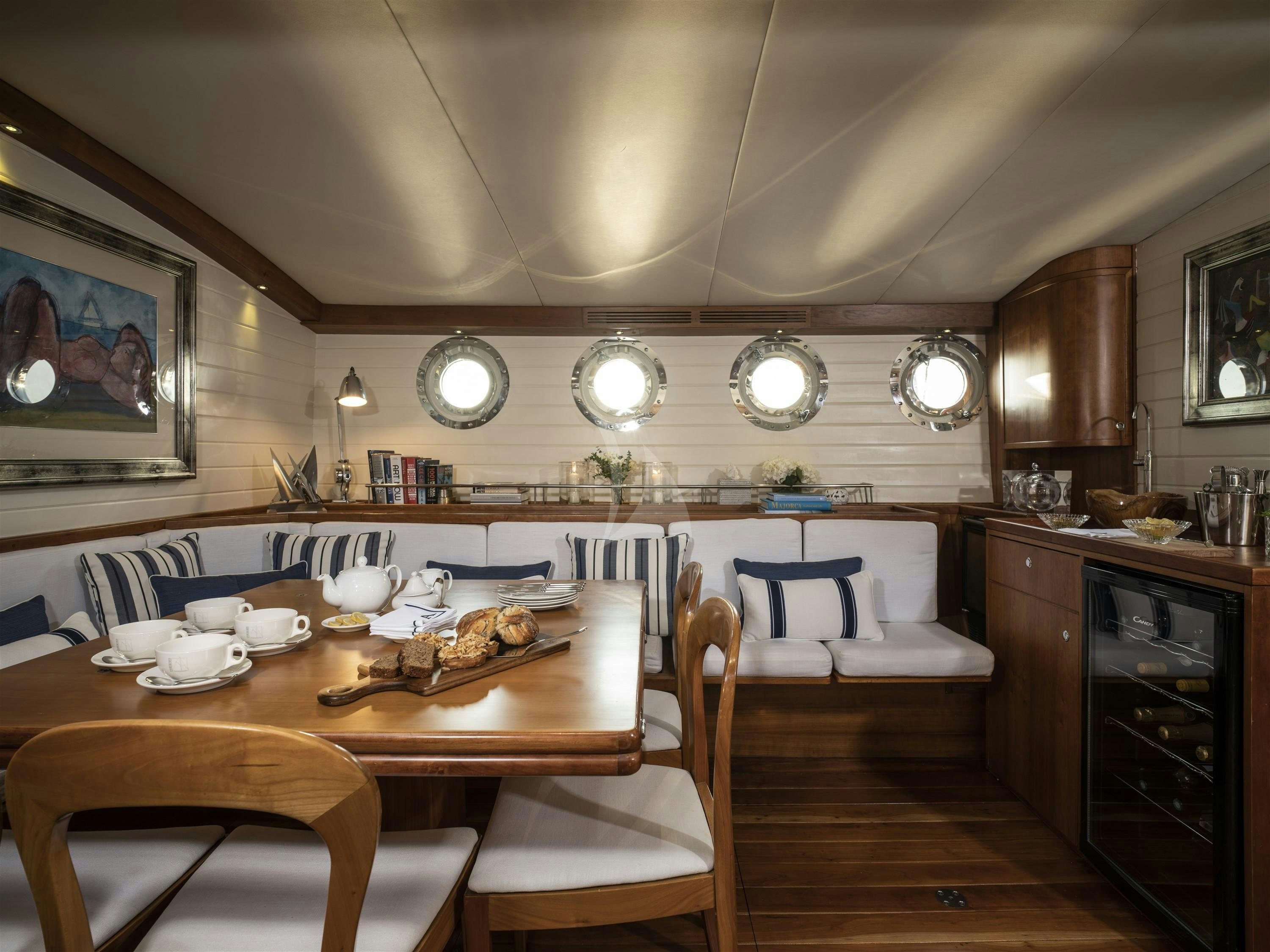 a dining room with a table and chairs aboard ALEXA OF LONDON Yacht for Charter
