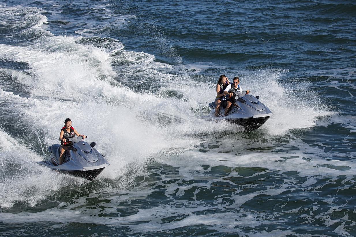 a group of people on a jet ski in the water aboard CHANTAL MA VIE Yacht for Charter