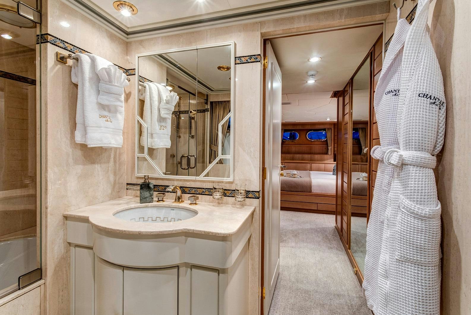 a bathroom with a sink and a mirror aboard CHANTAL MA VIE Yacht for Charter