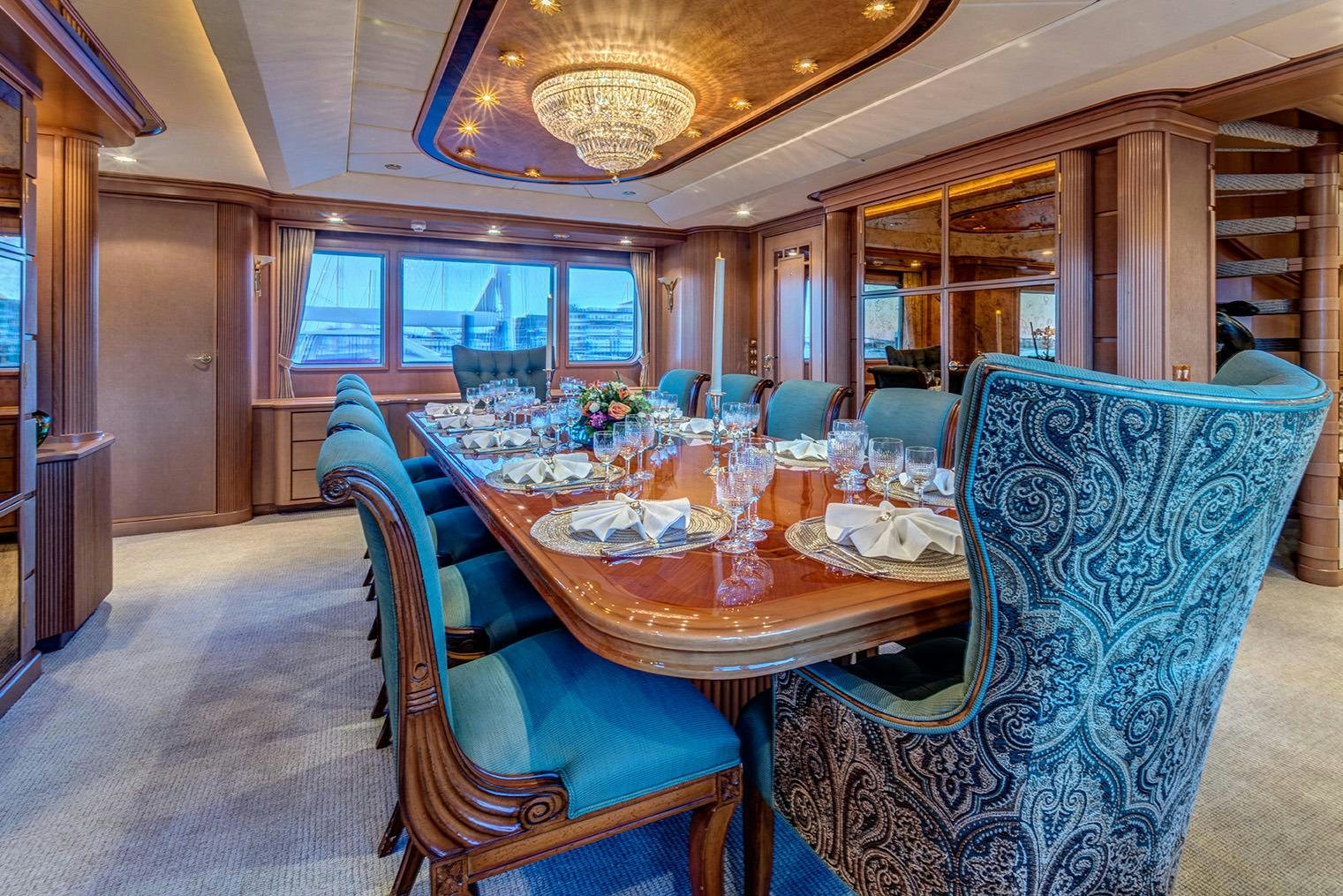 a dining room with a table aboard CHANTAL MA VIE Yacht for Charter
