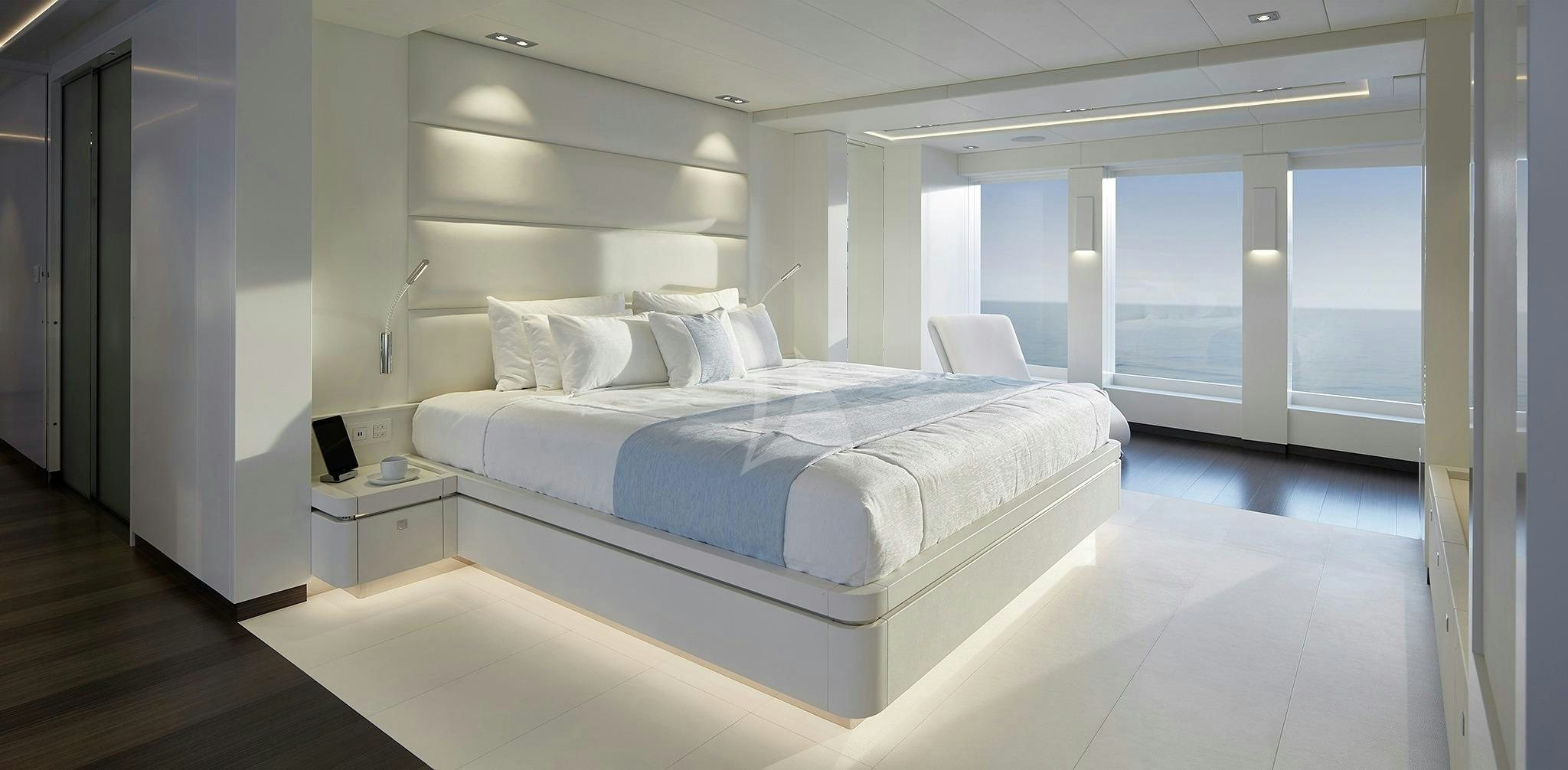 a large white bed in a room aboard HOME Yacht for Sale