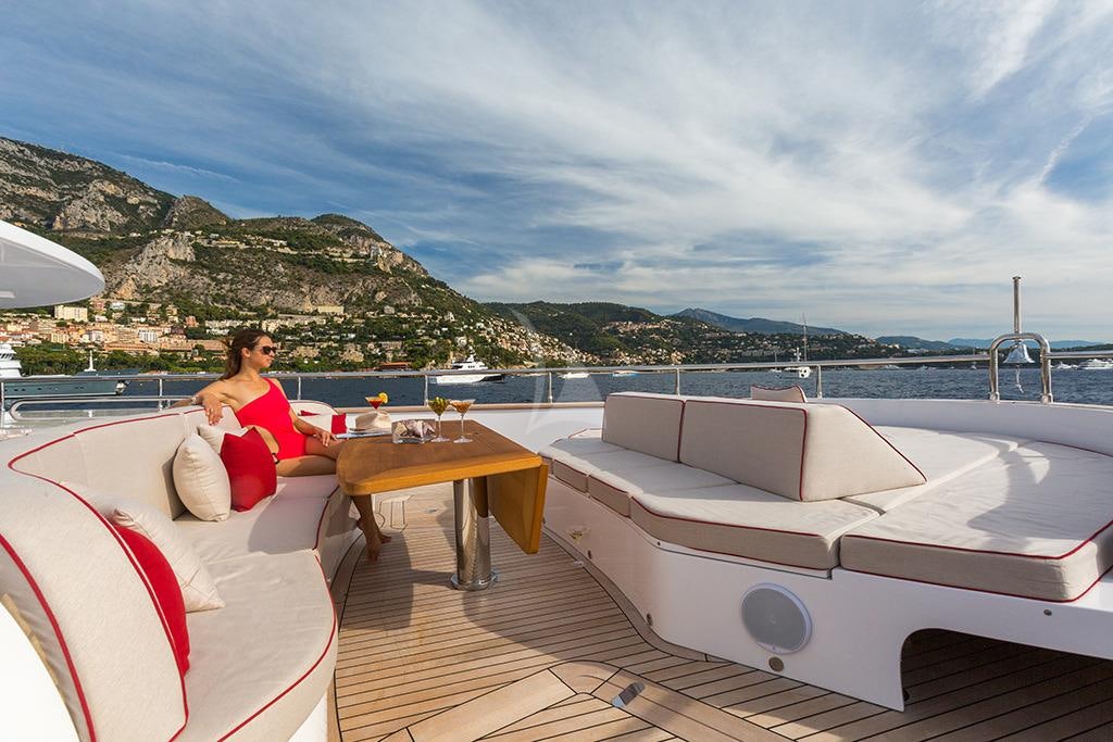a person sitting on a boat aboard GATSBY Yacht for Charter
