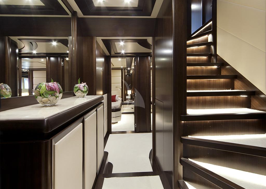 a kitchen with a large black staircase aboard GATSBY Yacht for Charter