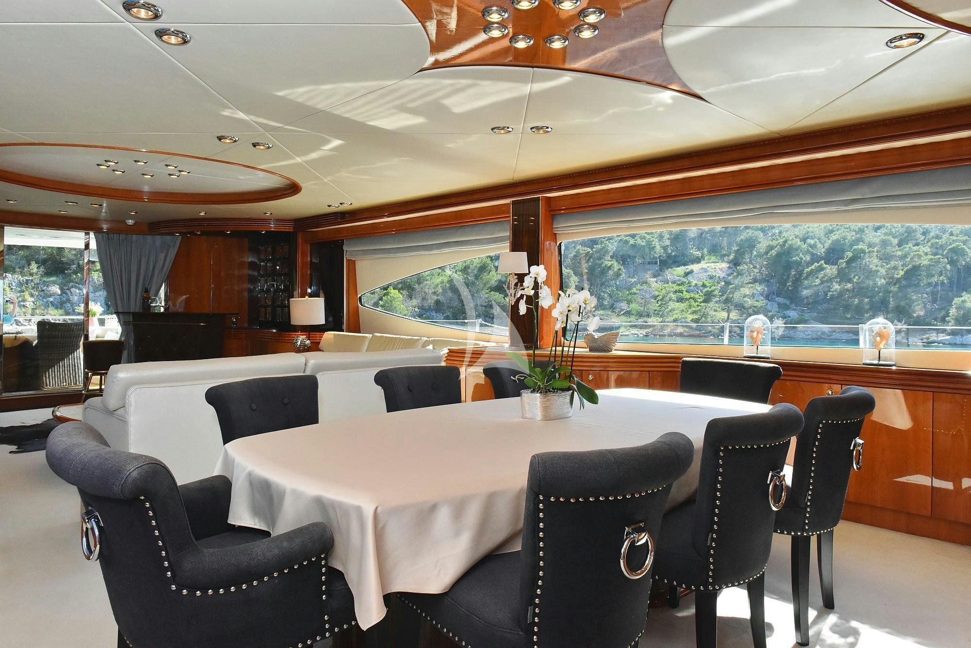 a dining room with a large table aboard BABY I Yacht for Charter