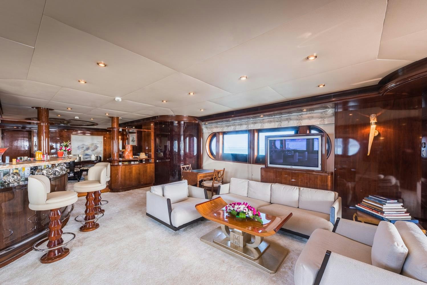 a living room with a large fireplace aboard ASHENA Yacht for Charter