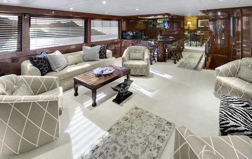 a living room with a couch and a coffee table aboard ASKARI Yacht for Charter