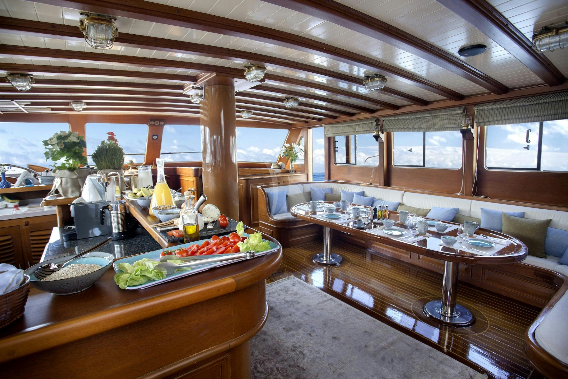 a kitchen with a table and food aboard ENTRE CIELOS Yacht for Charter