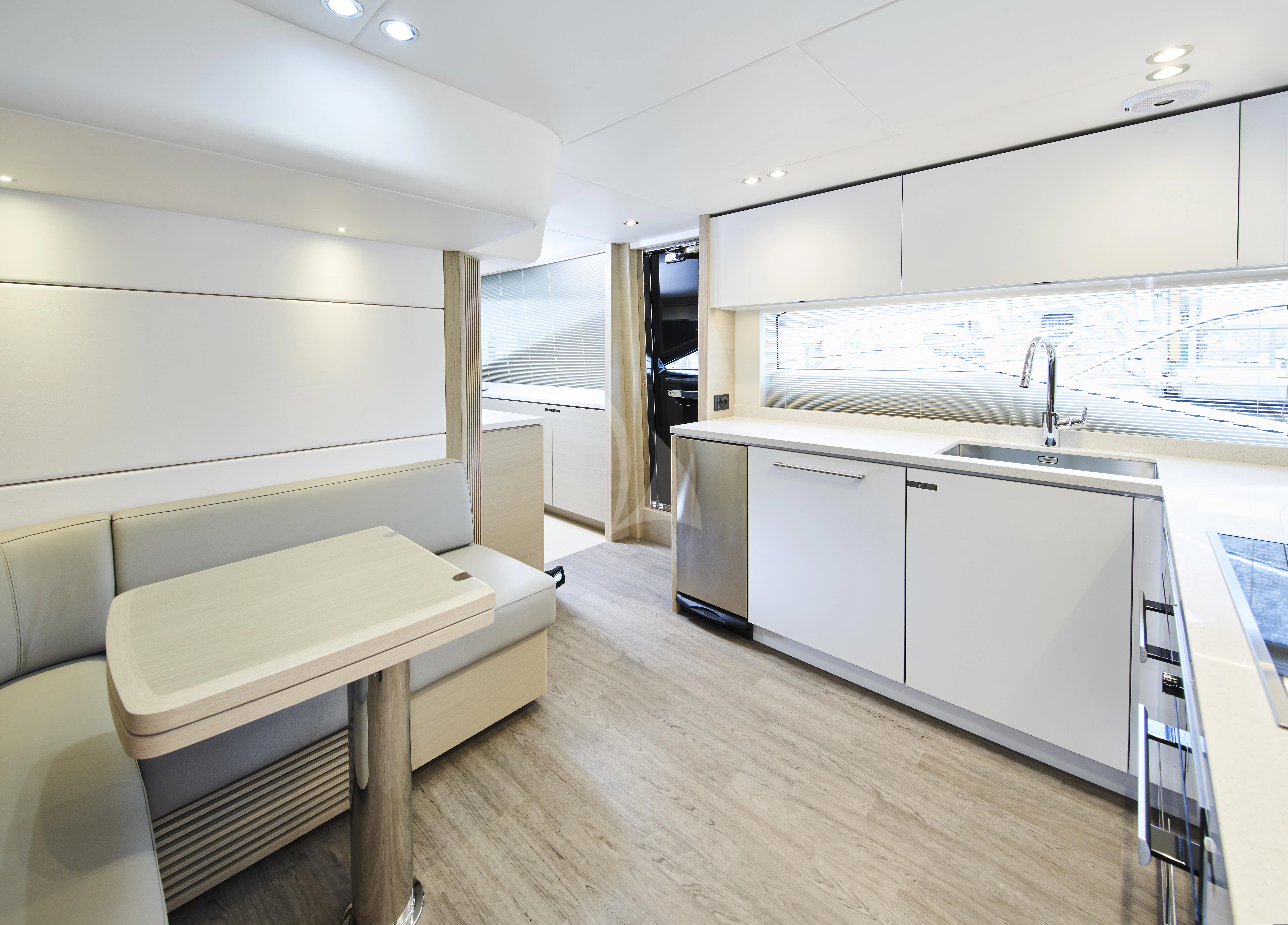 a kitchen with a couch and a table aboard HALLELUJAH Yacht for Charter