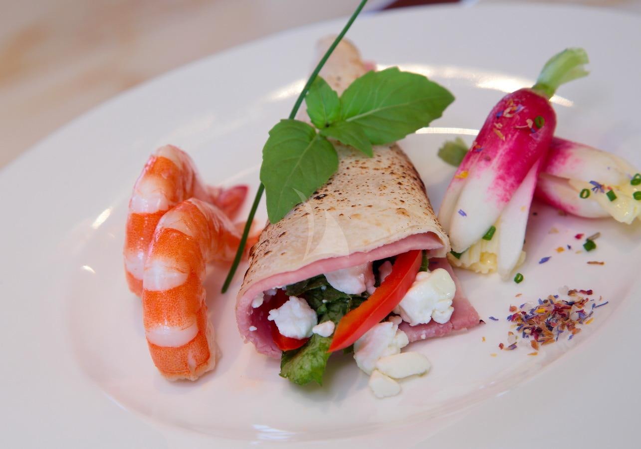 a plate of food aboard INOUIS Yacht for Charter