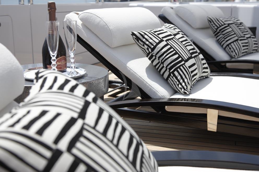 a table with a plate and a chair aboard HURRICANE RUN Yacht for Charter