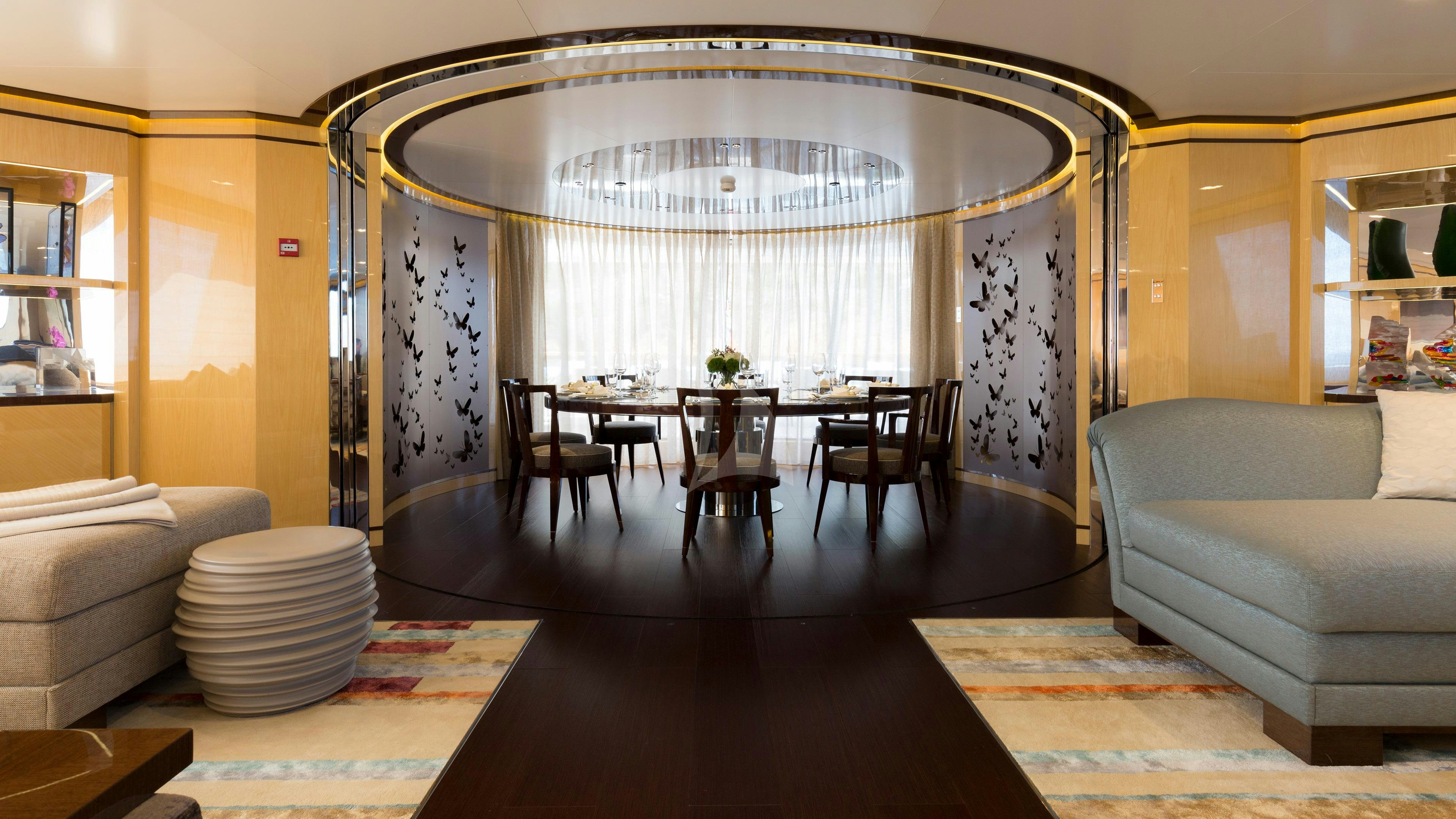 a living room with a chandelier aboard TAIBA Yacht for Charter