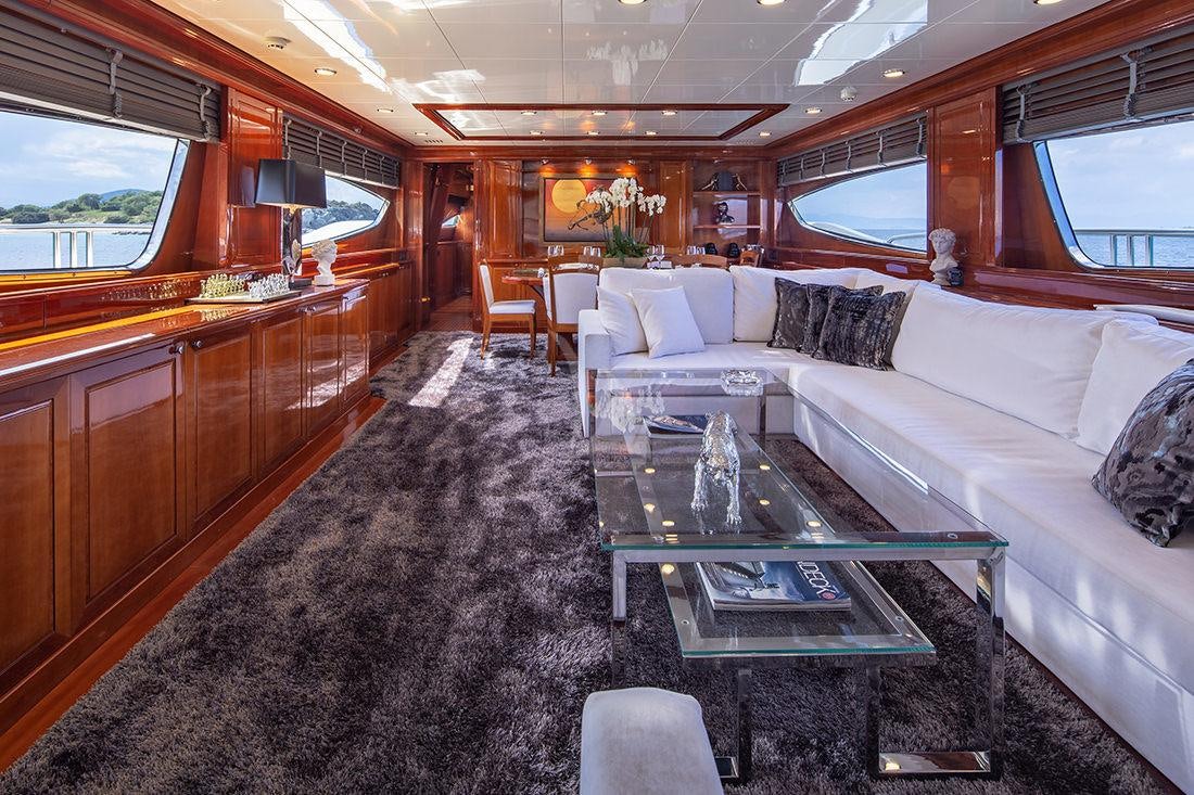 a living room with a large sofa aboard DIVINE Yacht for Charter