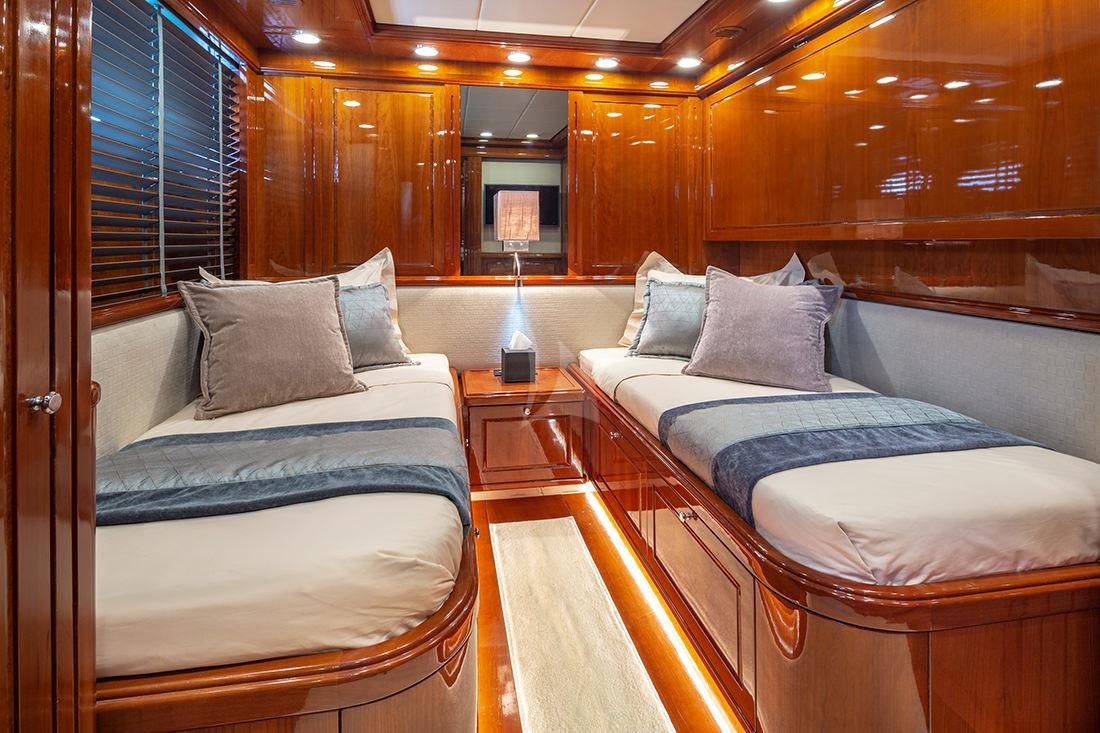 a couple of beds in a room aboard DIVINE Yacht for Charter