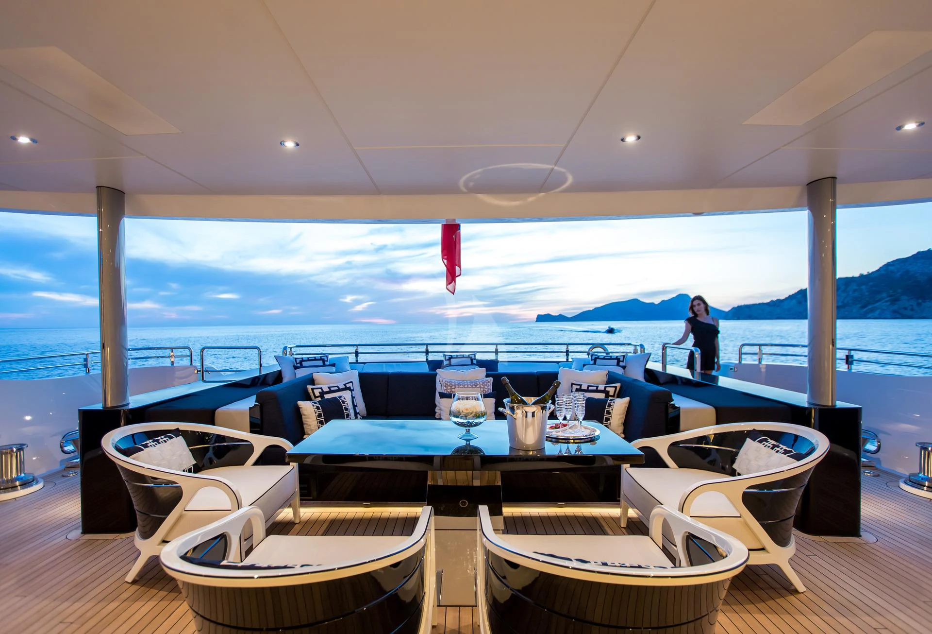 a person sitting at a table aboard LADY LI Yacht for Charter